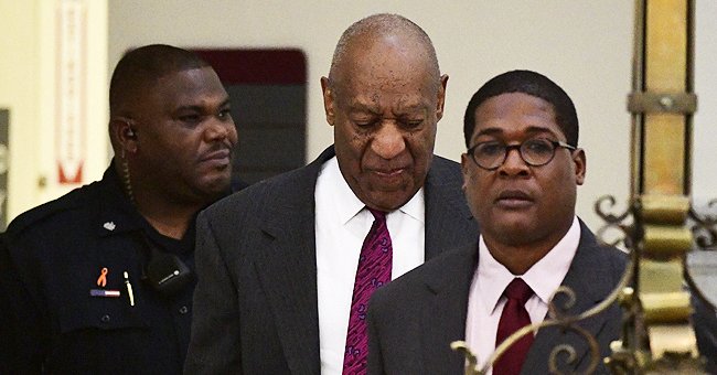 Picture of Bill Cosby being escorted out of prison. | Photo: Getty Images