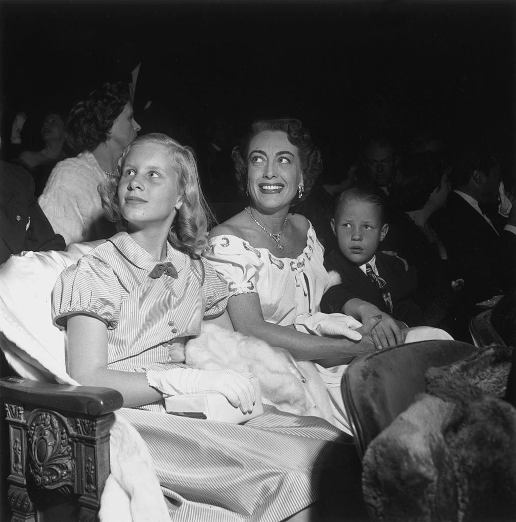 Joan Crawford with her children Christina, and Christopher, at the premiere of "The Hasty Heart" in Hollywood | Photo: Getty Images