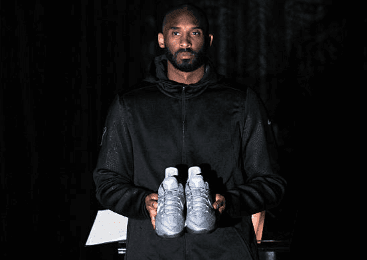 Kobe Bryant posing with his Kobe A.D. sneakers event for their release at MAMA Gallery on November 1, 2016, in Los Angeles, California | Source: Allen Berezovsky/Getty Images