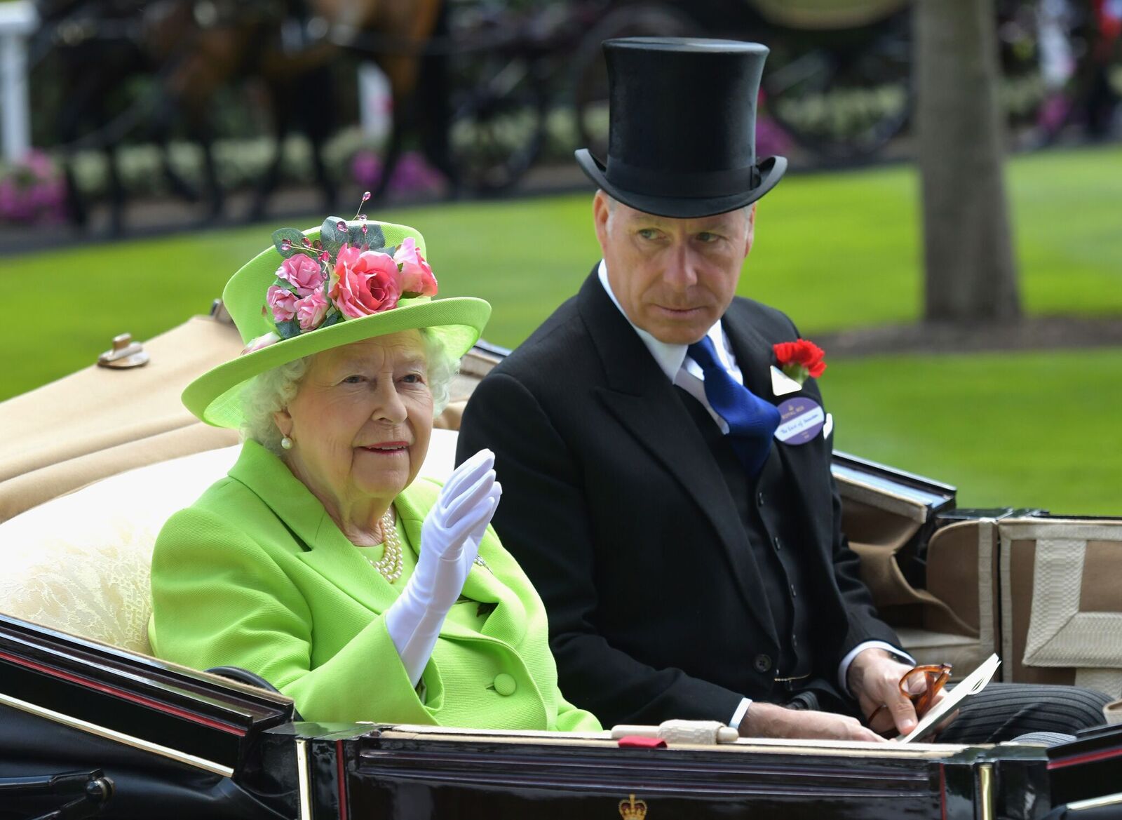 Queen Elizabeth II and David Armstrong-Jones, Earl of Snowdon arrive in the Royal procession on day 4 of Royal Ascot at Ascot Racecourse on June 22, 2018 in Ascot, England | Photo: Getty Images