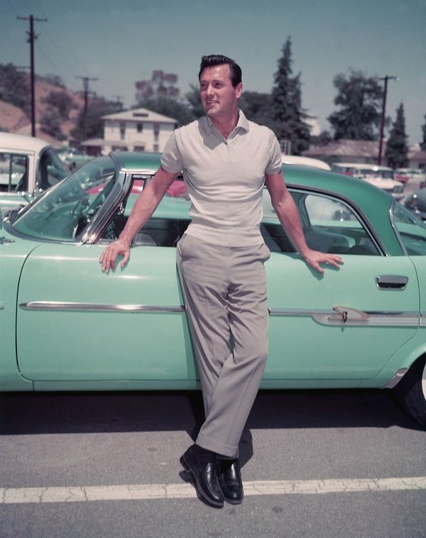 Rock Hudson leaning against a car in a parking lot circa 1950 | Source: Getty Images