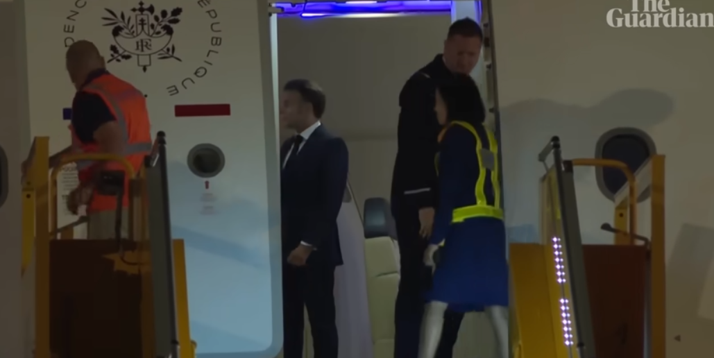 The moment the door to President Emmanuel and his wife Brigitte Macron's plane opened | Source: YouTube/The Guardian