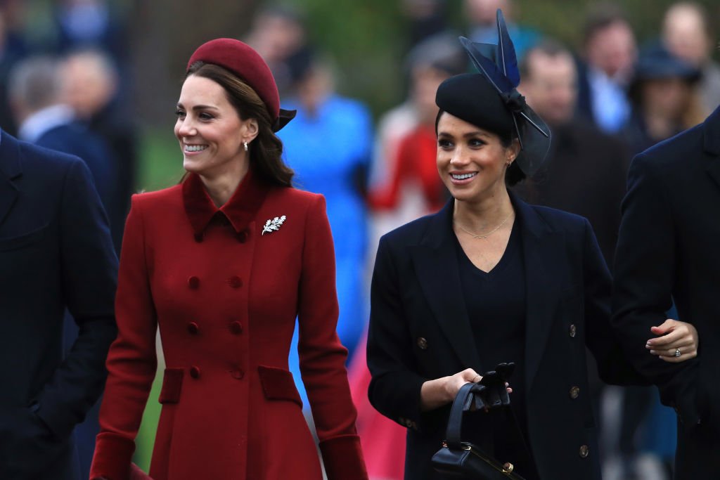  Catherine, Duchess of Cambridge and Meghan, Duchess of Sussex arrive to attend Christmas Day Church service at Church of St Mary Magdalene on the Sandringham estate. | Photo: Getty Images