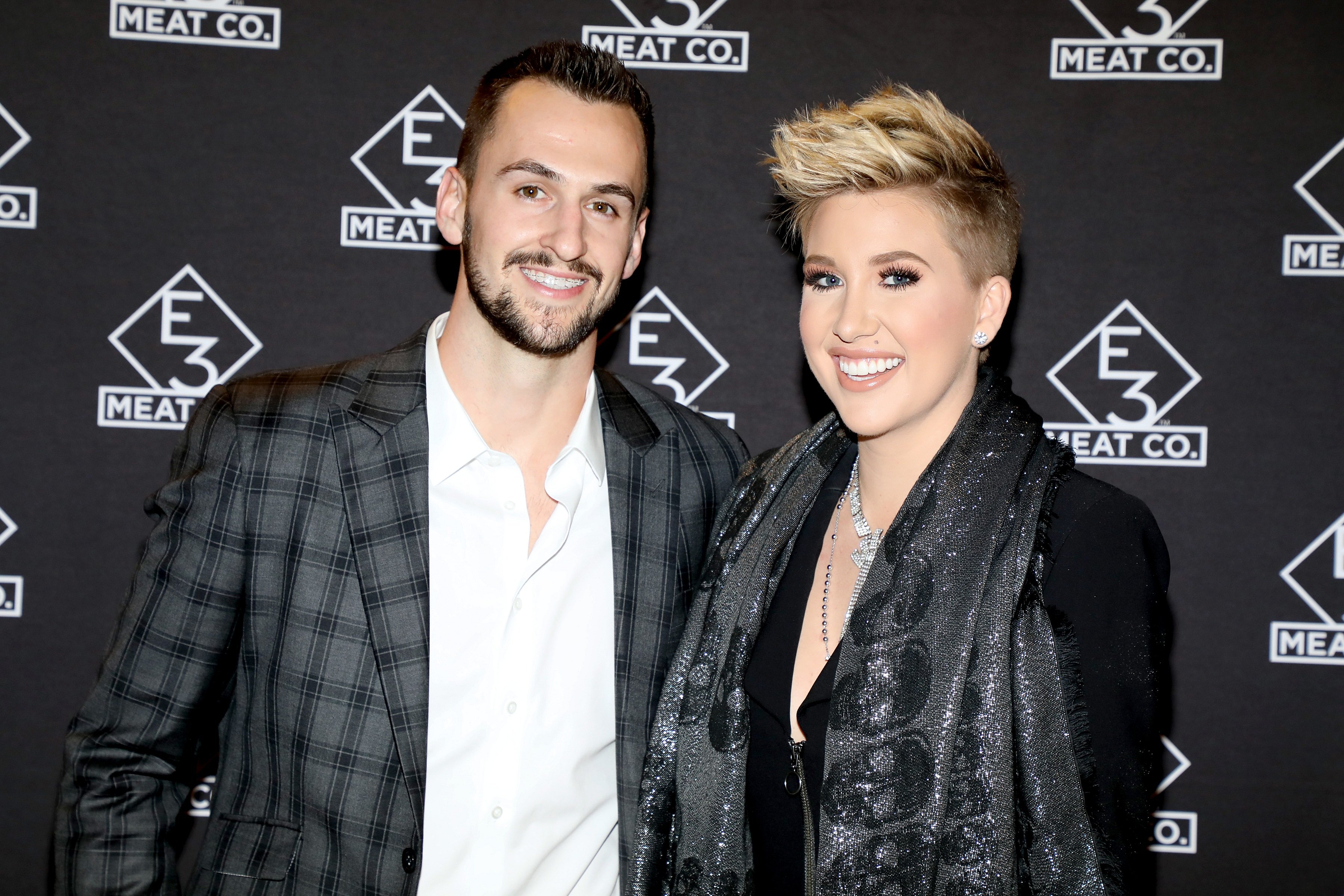 Nic Kerdiles and Savannah Chrisley attend the opening of E3 Chophouse Nashville on November 20, 2019. | Photo: Getty Images.
