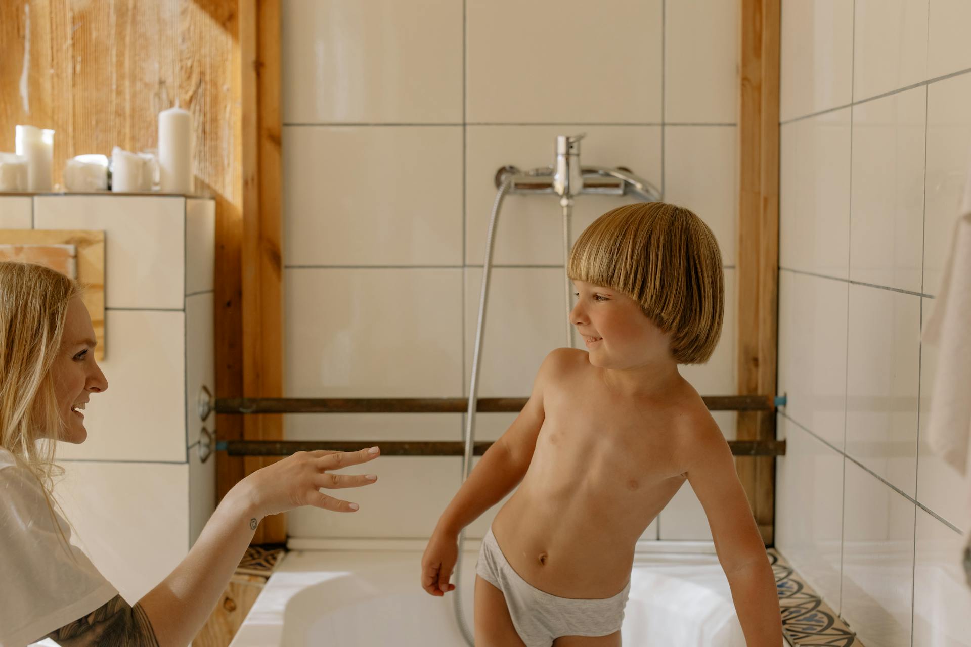 A mom with her son in the bathroom