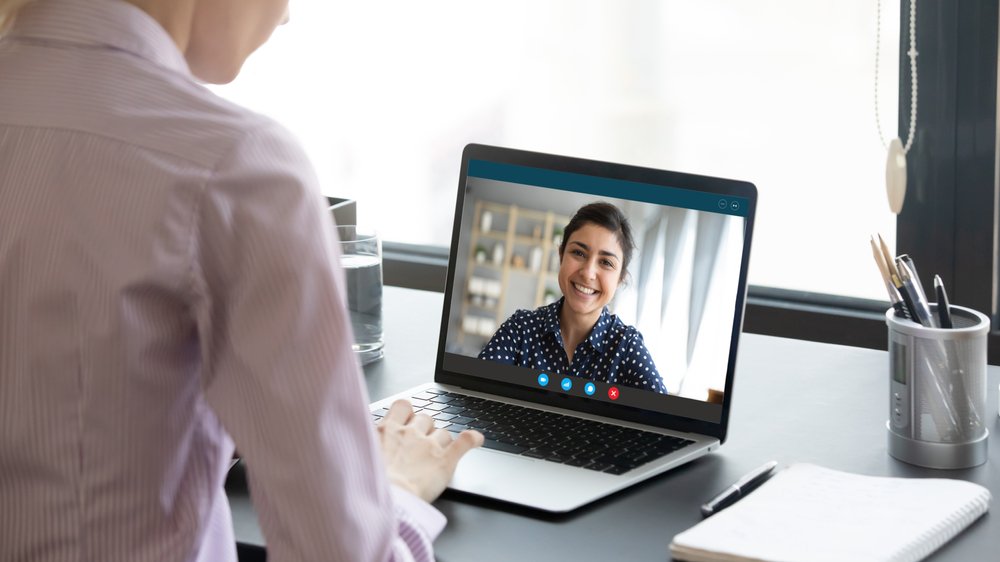 Mental health expert having an online therapy session with a client via a laptop | Photo: Shutterstock/fizkes