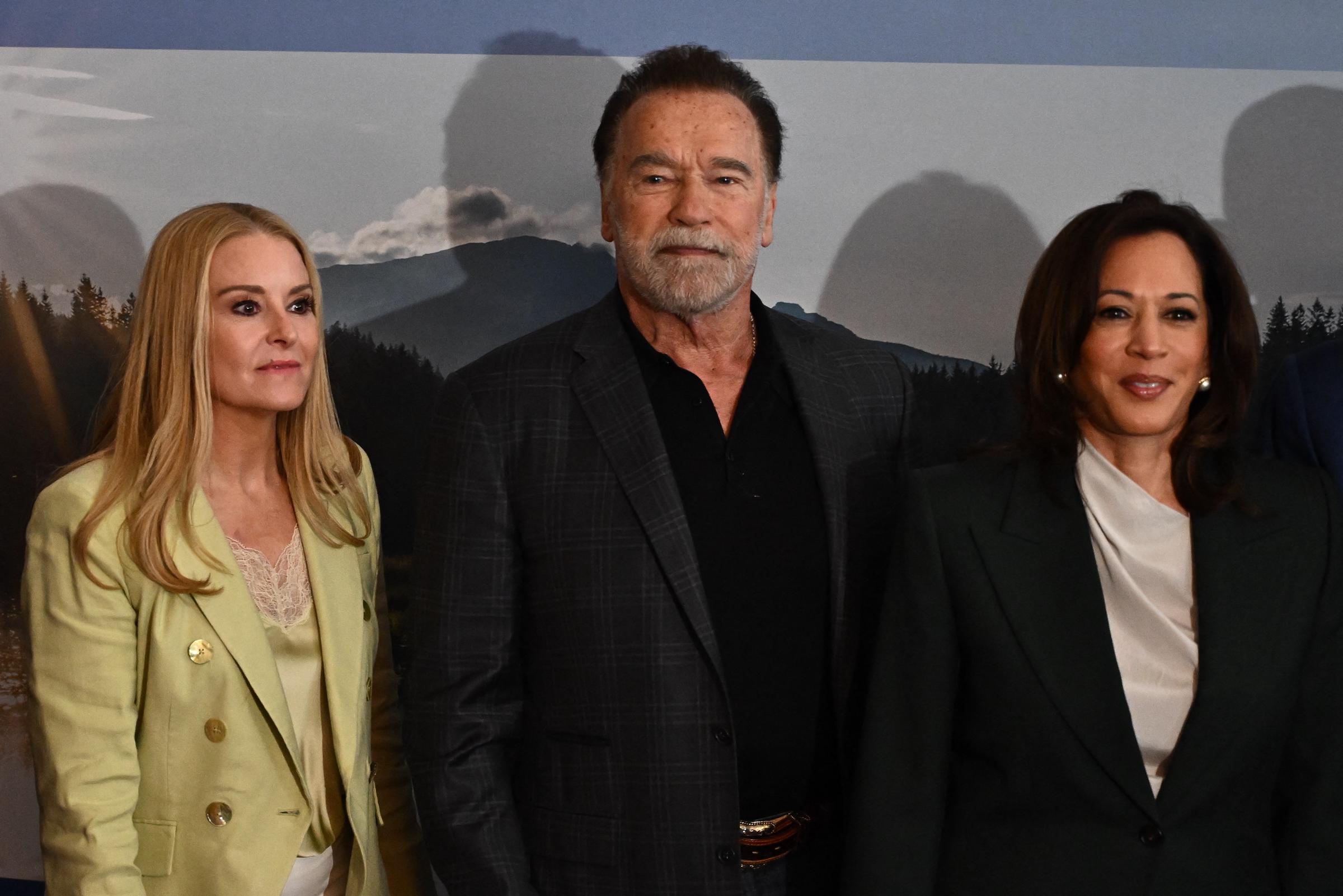 Netizens compared Heather Milligan's face to Maria Shriver after a clearer look at her features surfaced. In this photo, she, Arnold Schwarzenegger, and Kamala Harris posed for a picture as they arrived to attend the Austrian World Summit of the Schwarzenegger Climate Initiative at the Hofburg Palace on June 16, 2026, in Vienna, Austria. | Source: Getty Images