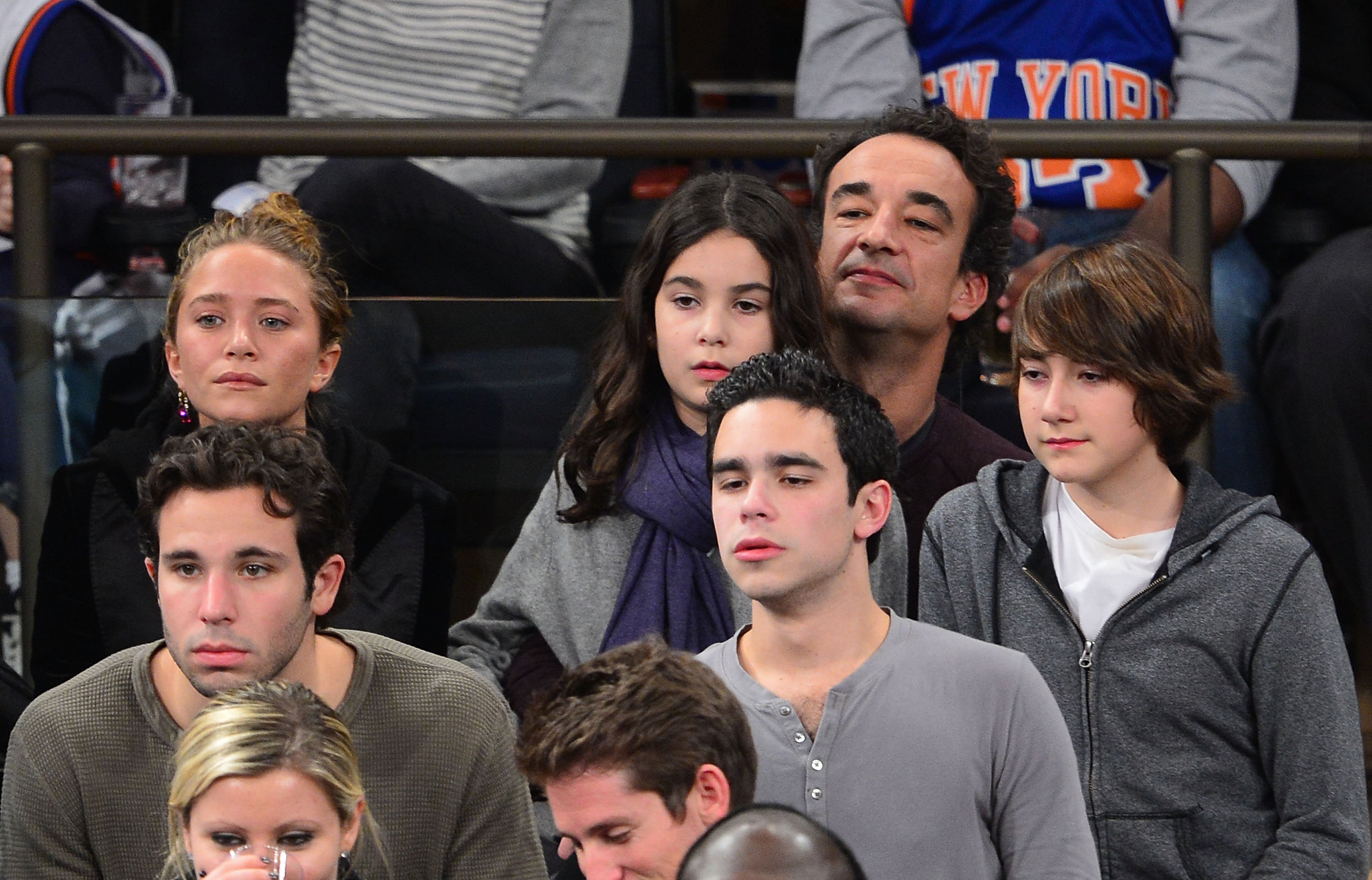Mary-Kate Olsen pictured with Olivier Sarkozy and his children during the Dallas Mavericks vs New York Knicks game at Madison Square Garden on November 9, 2012 in New York City. / Source: Getty Images