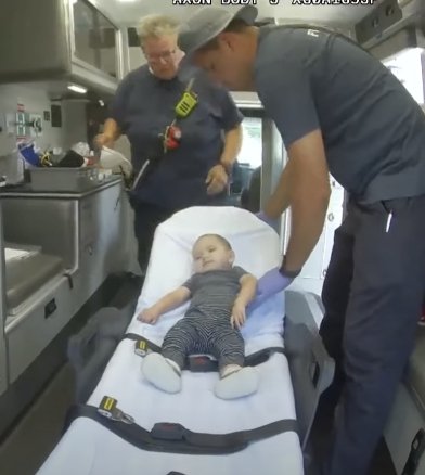 10-month-old Nathan Jimenez being carried away in an ambulance | Source: Youtube/WGN News