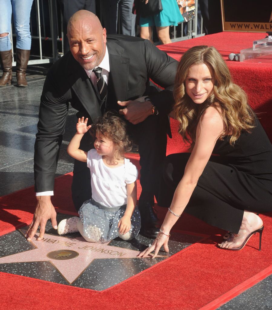 Dwayne "The Rock" Johnson accepting his Hollywood Walk of Fame star with then-girlfriend Lauren Hashian | Source: Getty Images/GlobalImagesUkraine