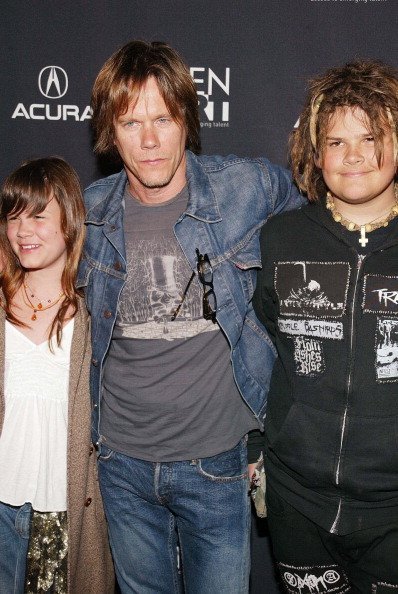 Kevin Bacon with his children, Sosie and Travis, at the Gen Art Film Festival opening at The Ziegfeld Theater in New York, April 2005 | Source: Getty Images