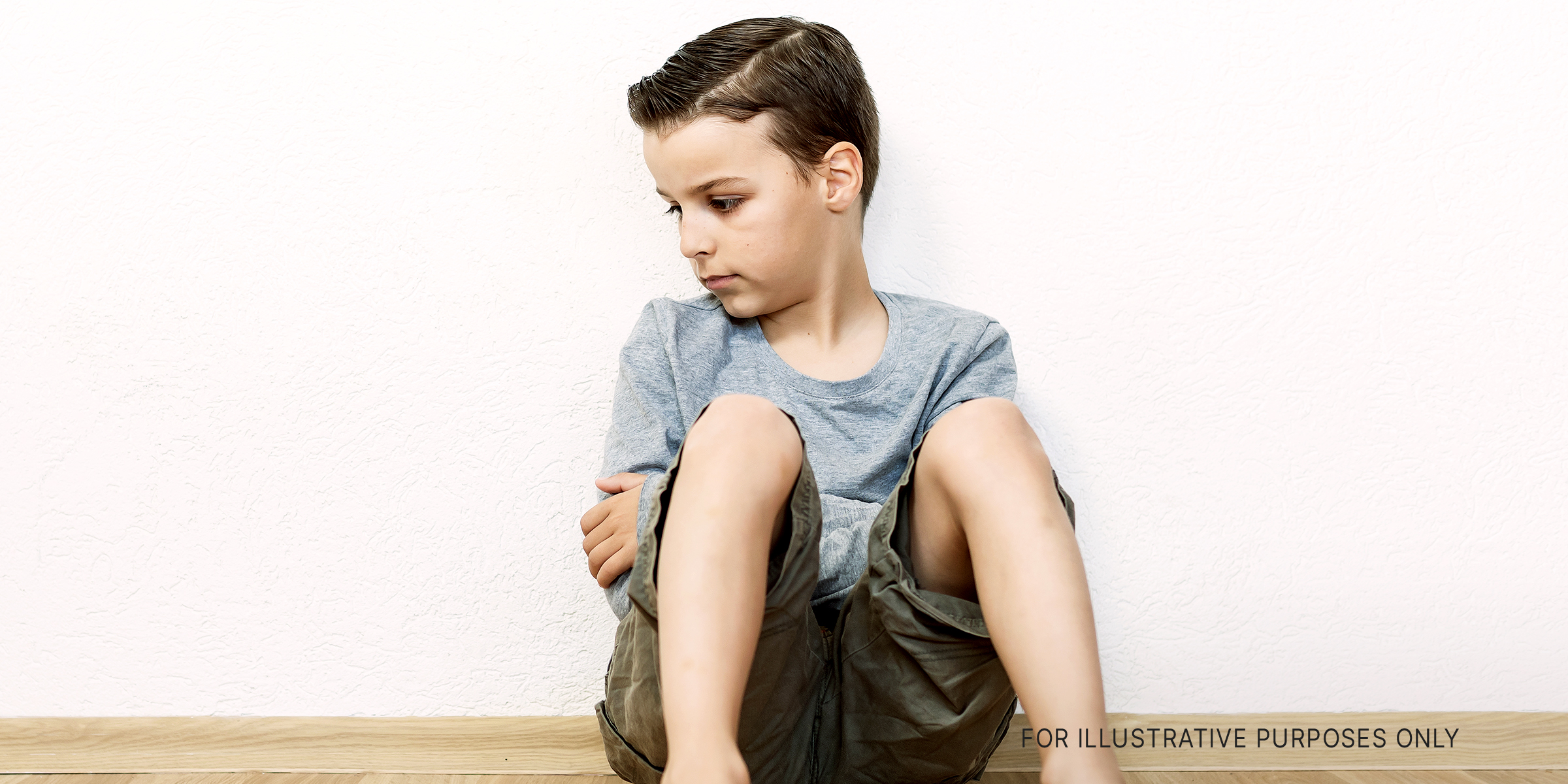 Sad boy sitting lonely | Source: Shutterstock