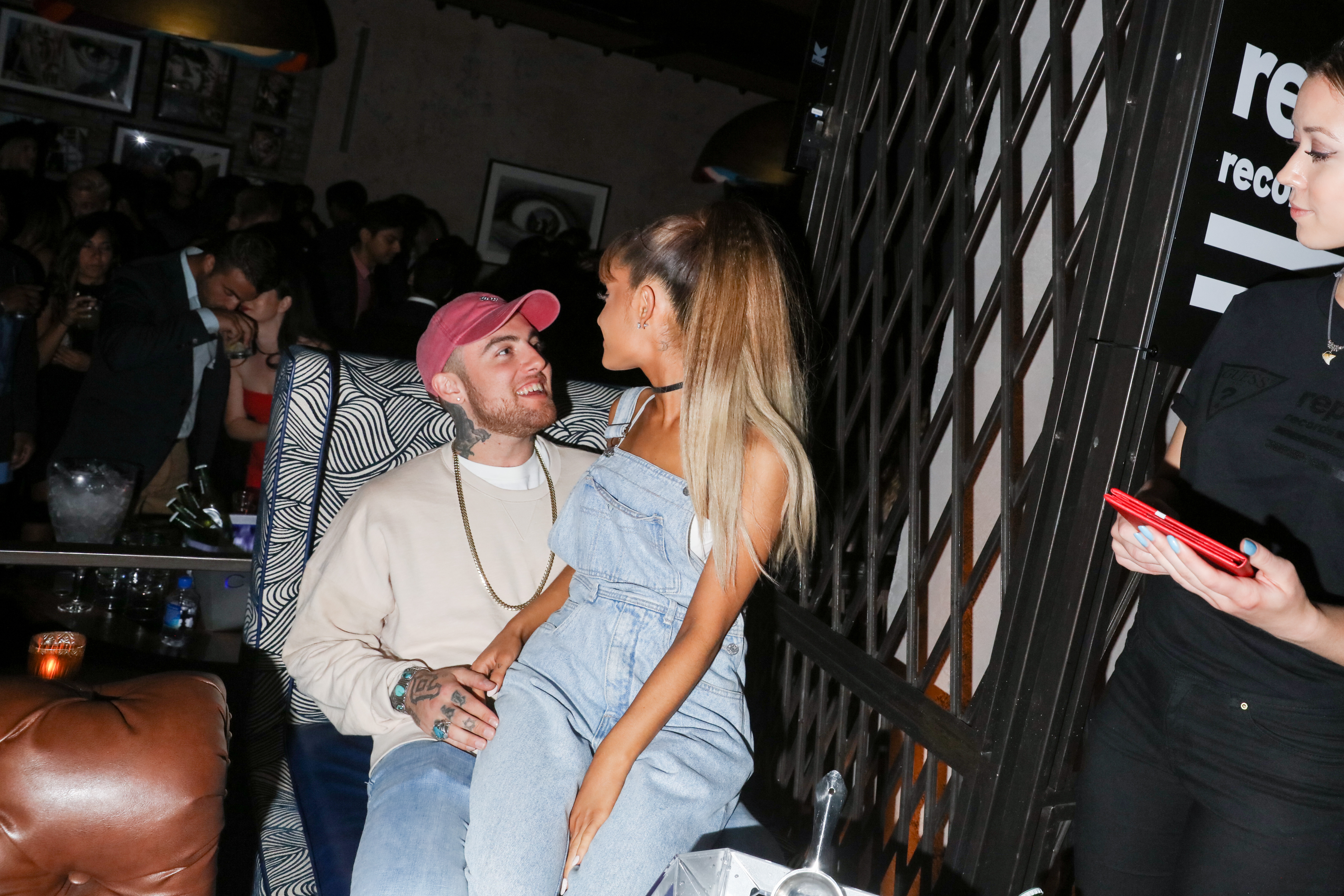 Ariana Grande photographed sitting on Mac Miller's lap at the Republic Records 2016 VMA afterparty at Vandal on August 28, 2016 in New York | Source: Getty Images