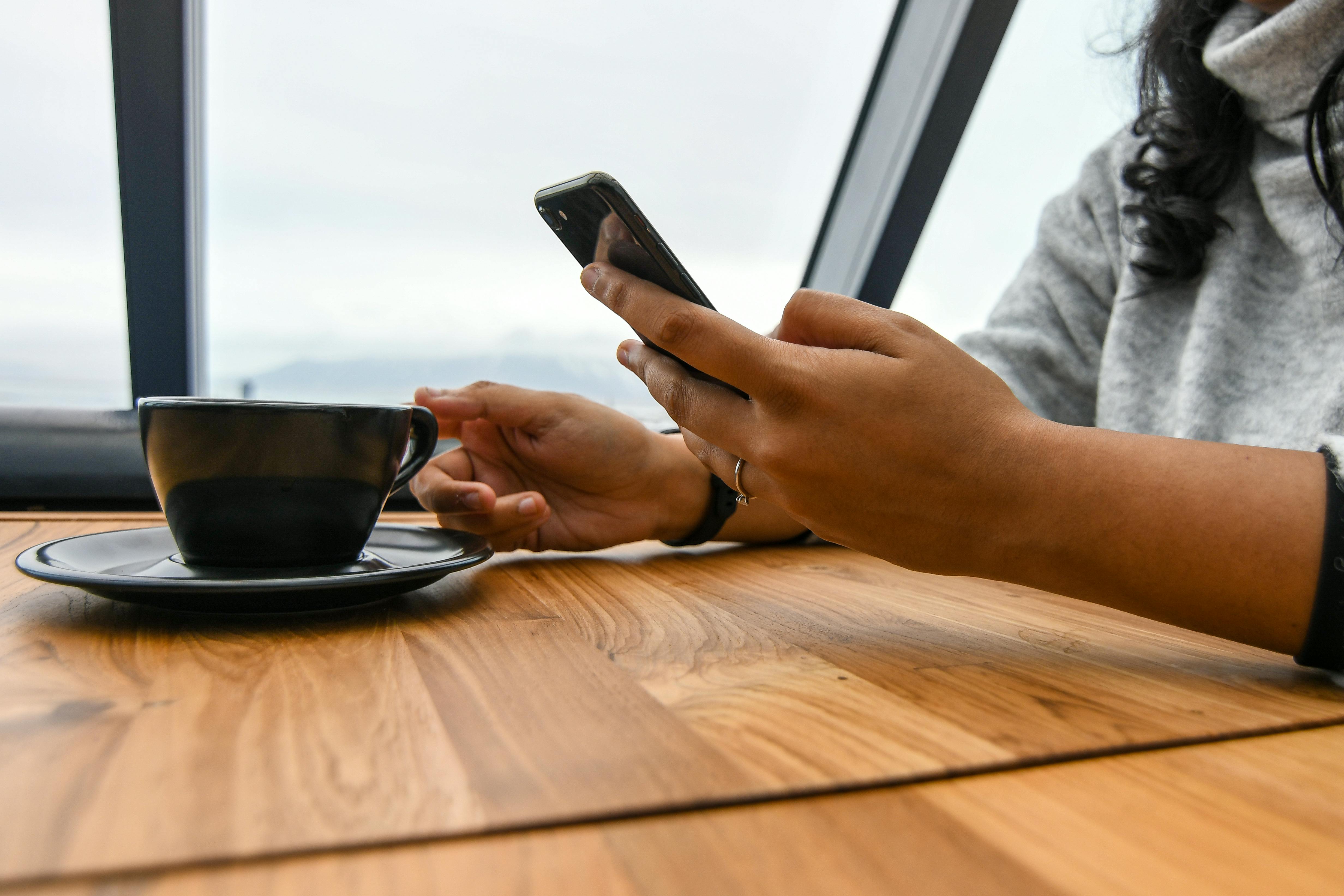 A woman holding a phone | Source: Pexels