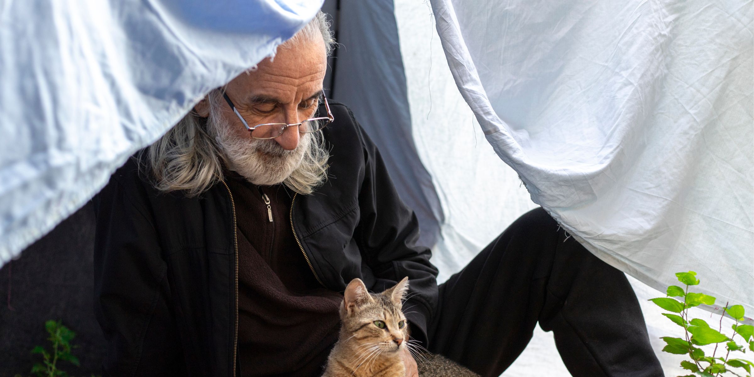 Senior man with a cat | Source: Shutterstock