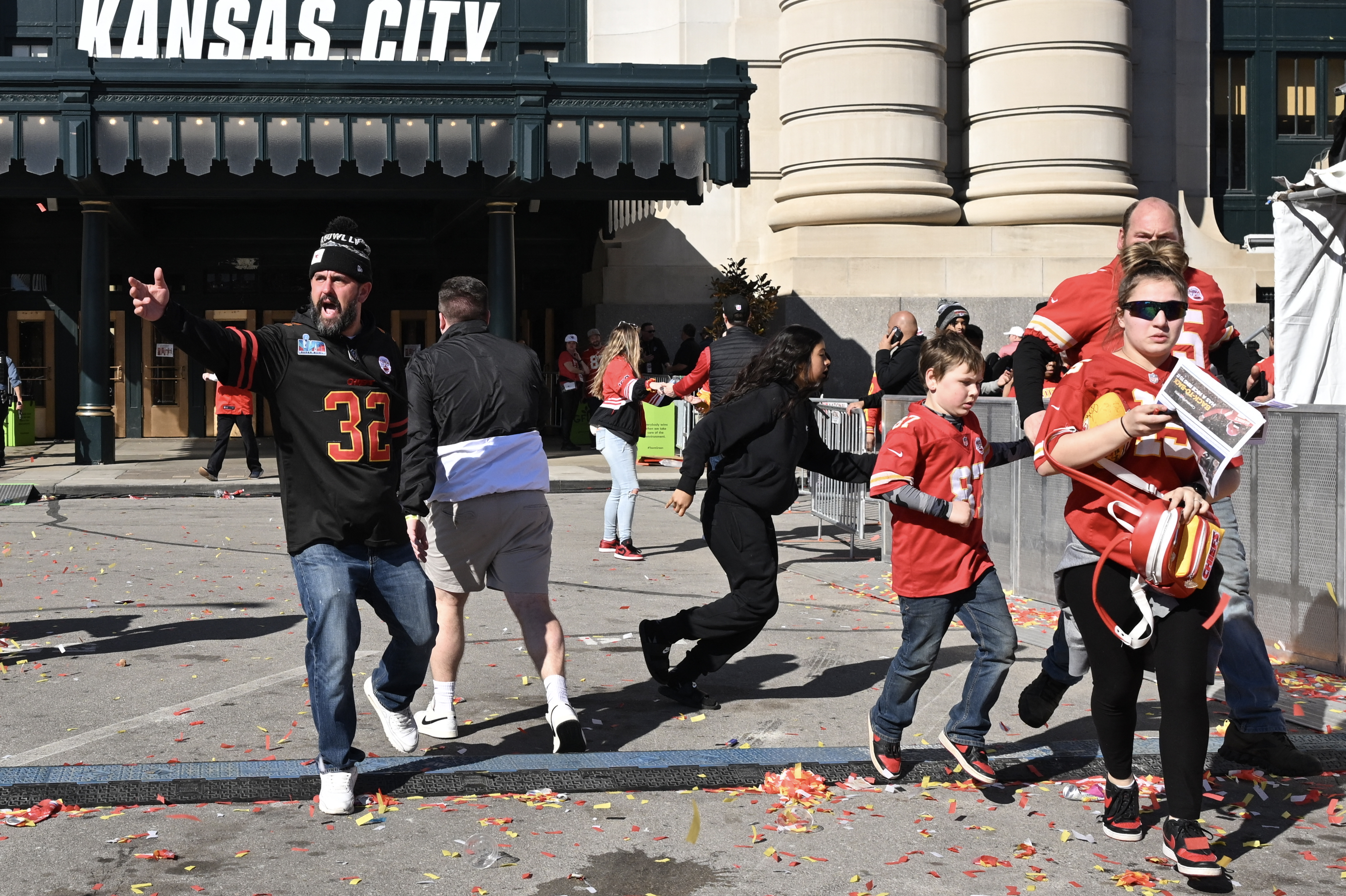 Civilians fleeing after gunshots broke out at the Super Bowl LVIII victory parade in Kansas City, Missouri on February 14, 2024 | Source: Getty Images