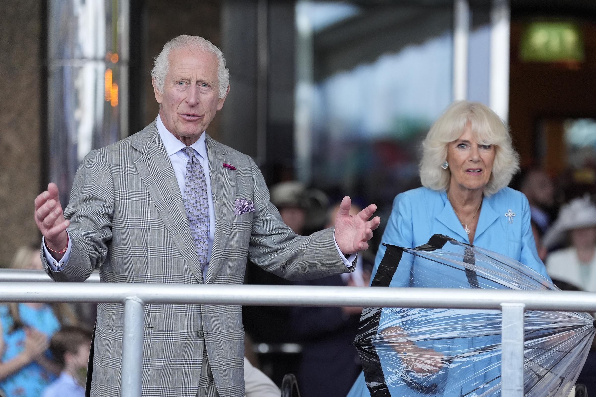 King Charles III and Queen Camilla stand outside Pomme d'Or Hotel, Liberation Square in St. Helier, Jersey on  July 15, 2024. | Source: Getty Images