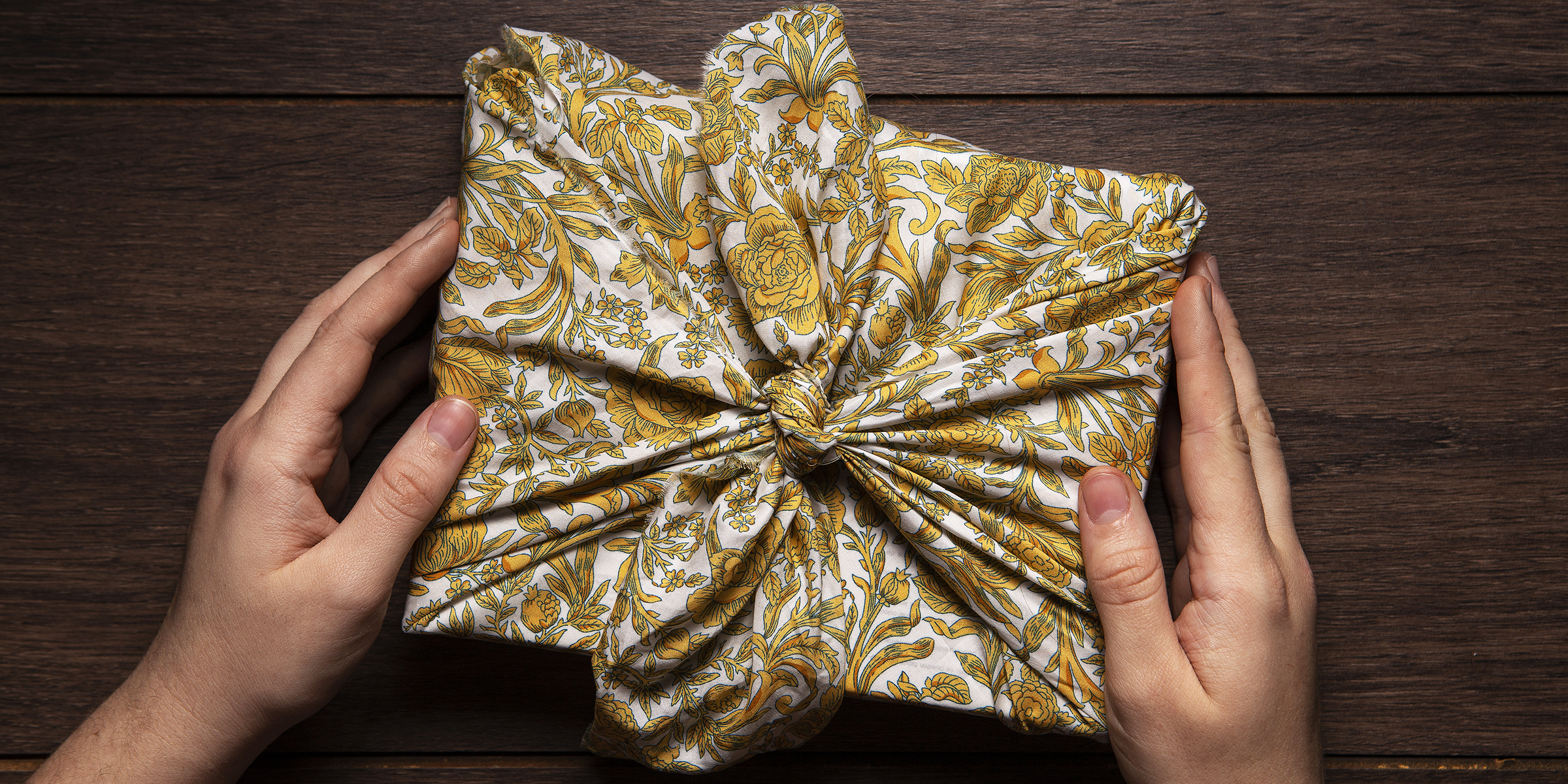 A gift wrapped in material | Source: Freepik