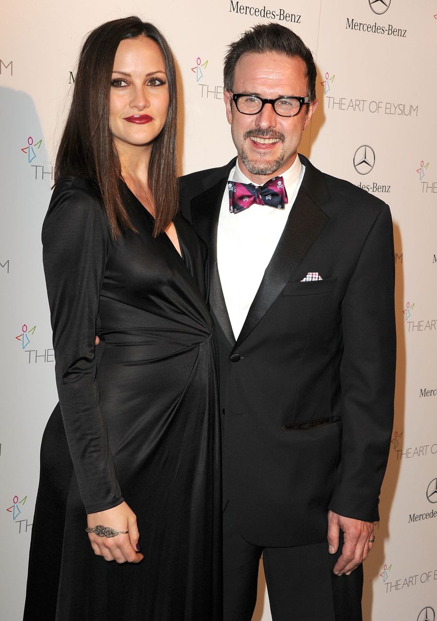 Christina McLarty and David Arquette at the The Art of Elysium's 7th Annual HEAVEN Gala Presented By Mercedes-Benz on January 11, 2014 in Los Angeles, California. | Source: Getty/Steve Granitz/WireImage