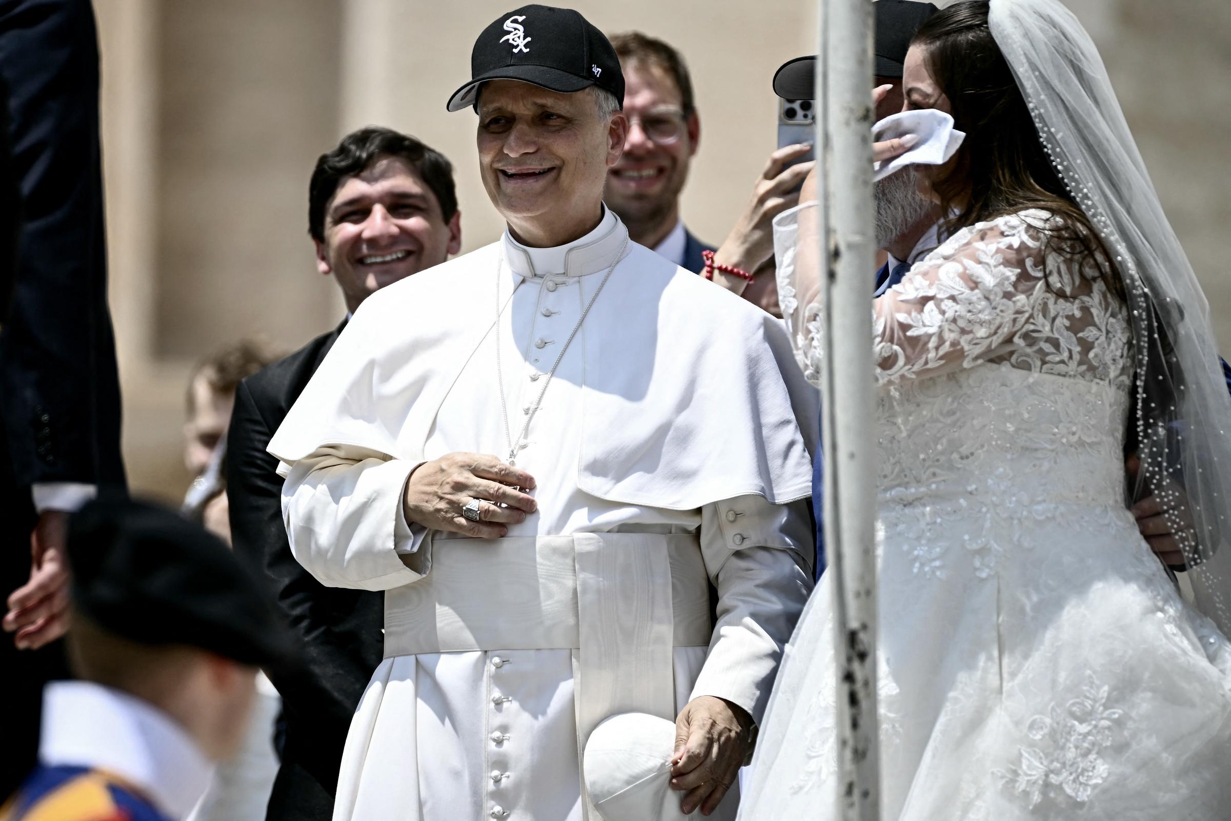 Pope Leo XIV wears a White Sox cap while meeting newlyweds at the Vatican on June 11, 2025 | Source: Getty Images