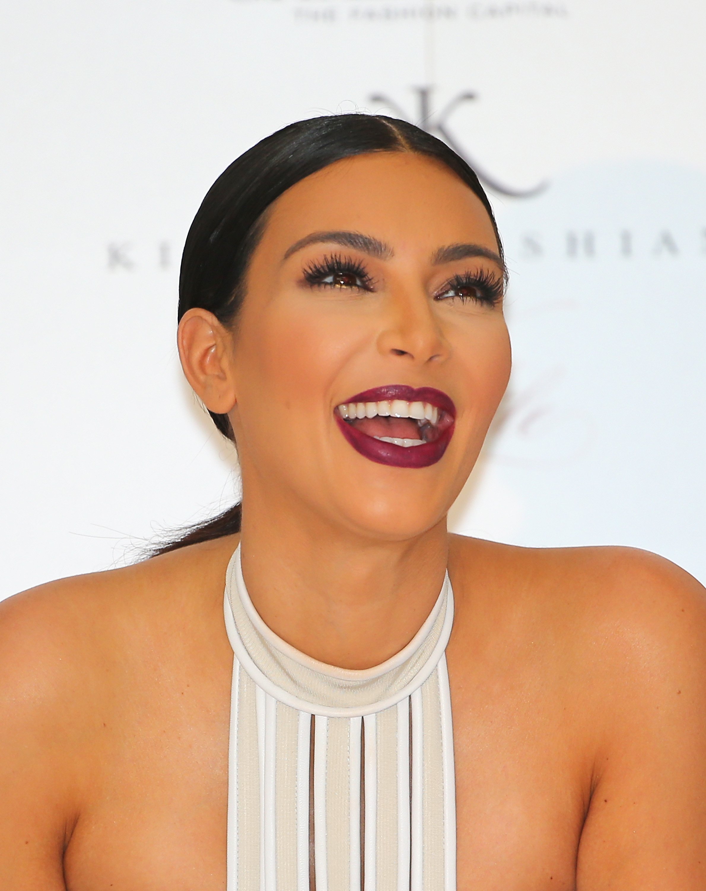Kim Kardashian laughs as she promotes her new fragrance "Fleur Fatale" at Chadstone Shopping Center | Source: Getty Images