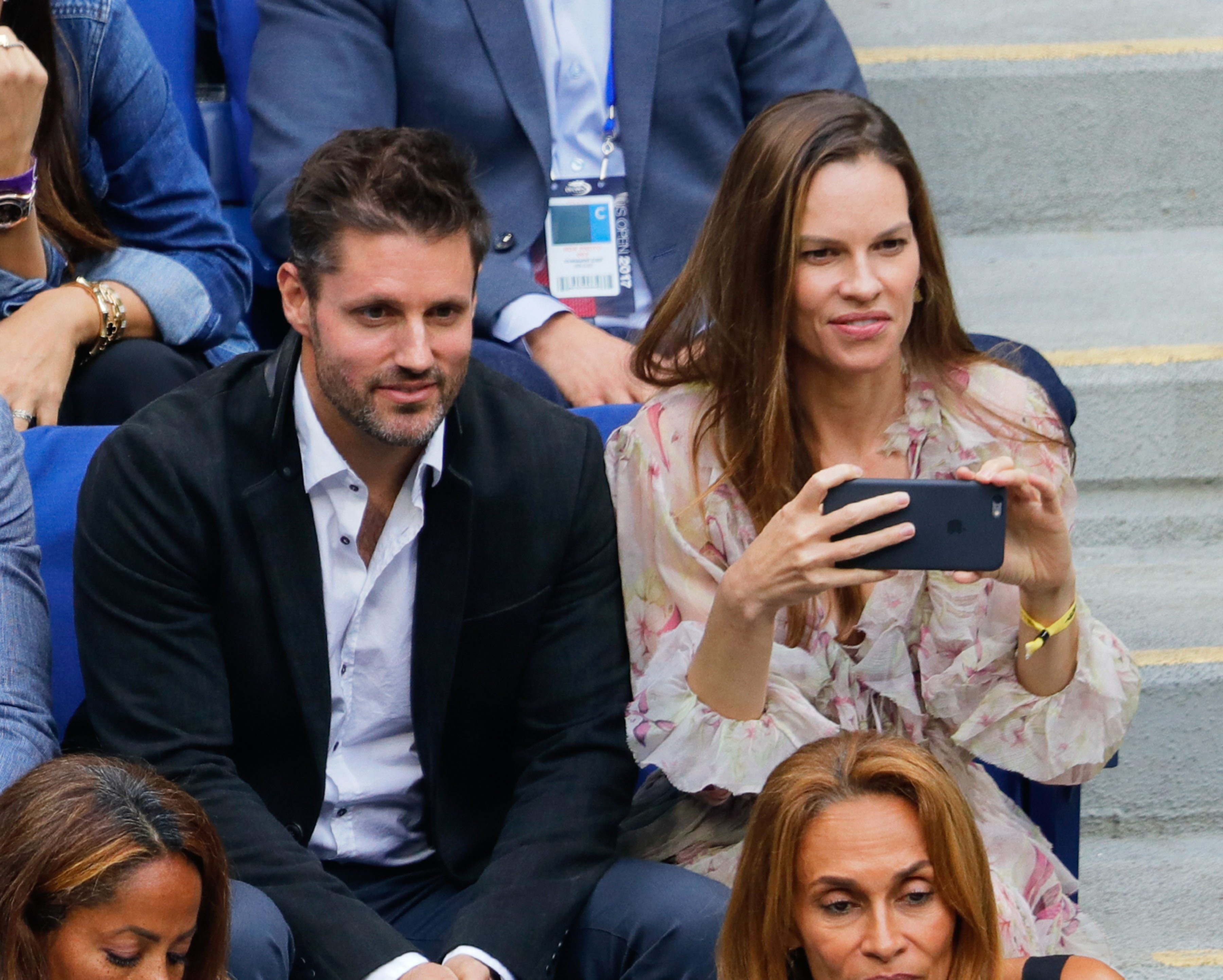 Hilary Swank and Philip Schneider during the 2017 US Open Women's Final at Arthur Ashe Stadium on September 9, 2017 in New York City | Source: Getty Images