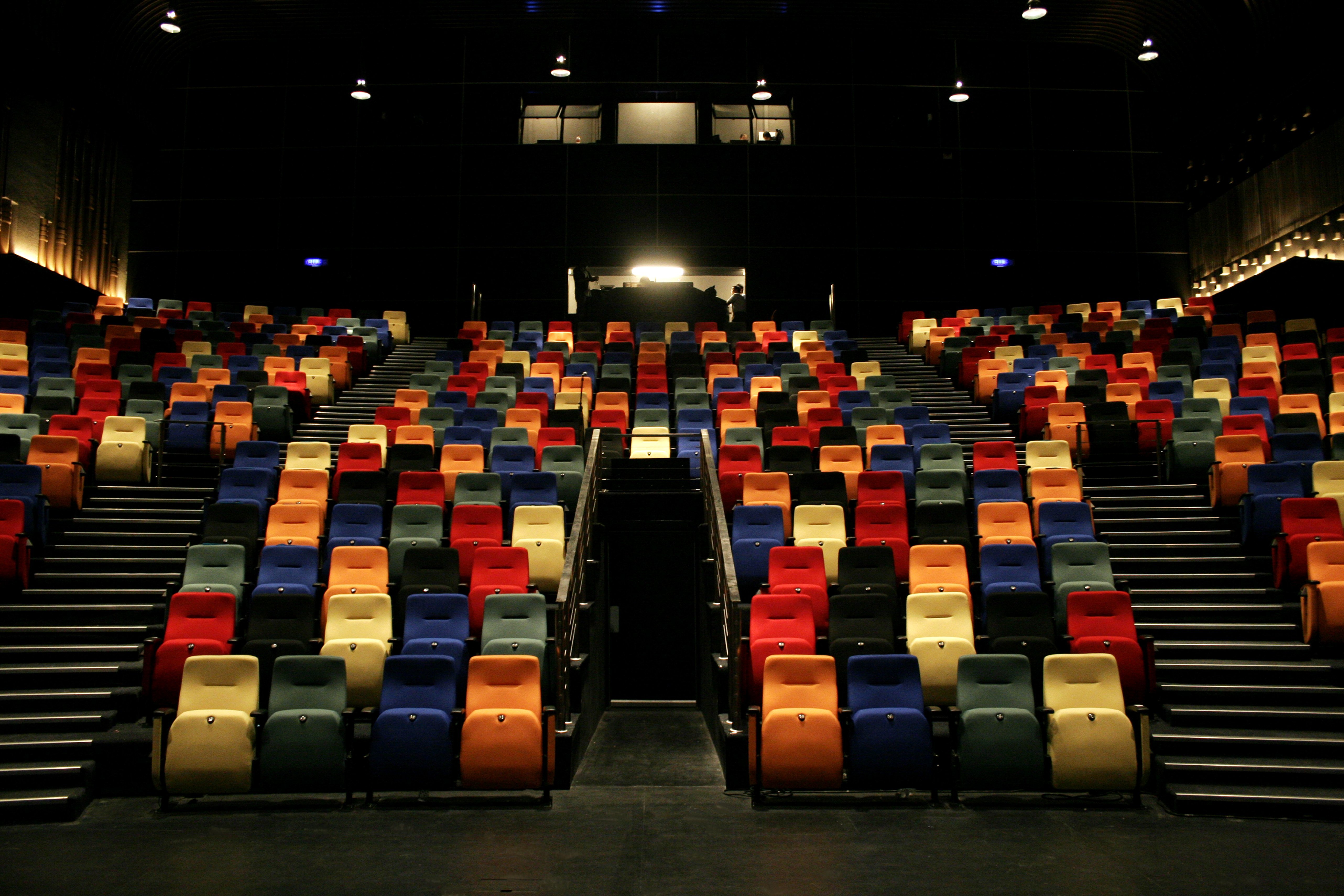 View of multicolored seats in the darkened auditorium of the new Kuala Lumpur Performing Arts Centre | Photo: Getty Images