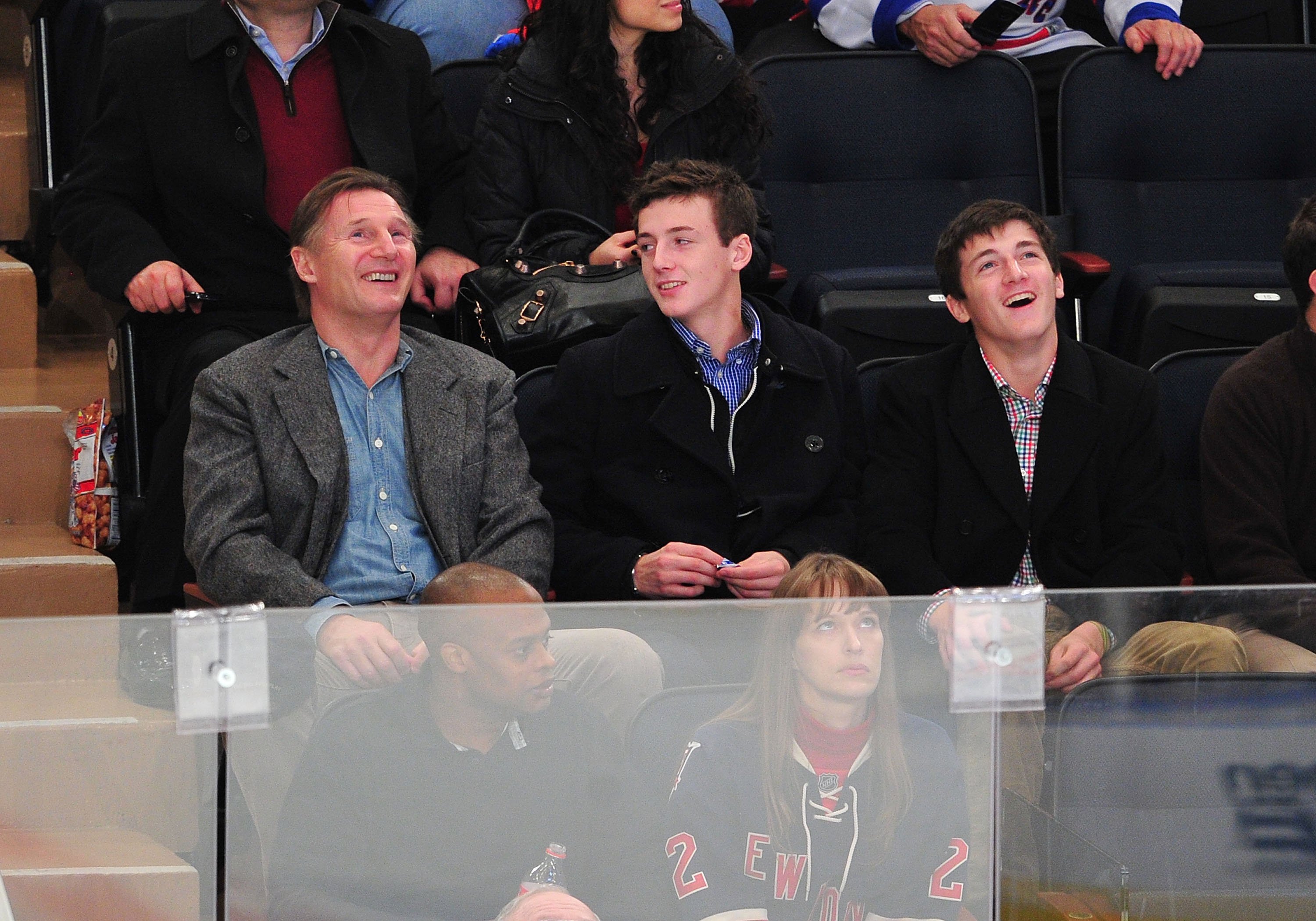 Liam Neeson with sons, Michael Neeson and Daniel Neeson, during the San Jose Sharks vs the New York Rangers game at Madison Square Garden on October 31, 2011 in New York City. / Source: Getty Images