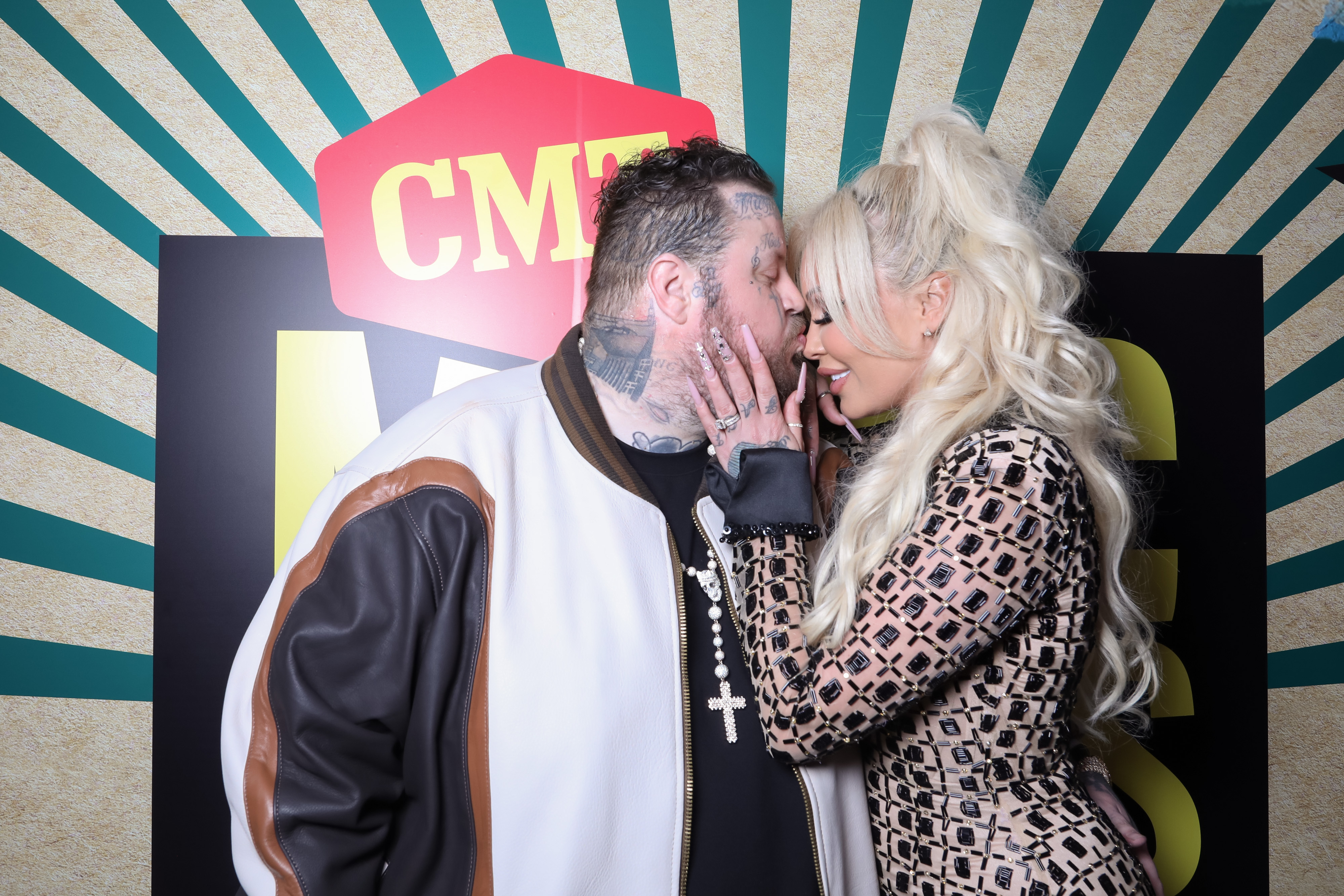Jelly Roll and Bunnie XO share an intimate moment at an event. Bunnie later revealed that their dream of having a child together led them through IVF treatments and multiple heartbreaking losses. | Source: Getty Images
