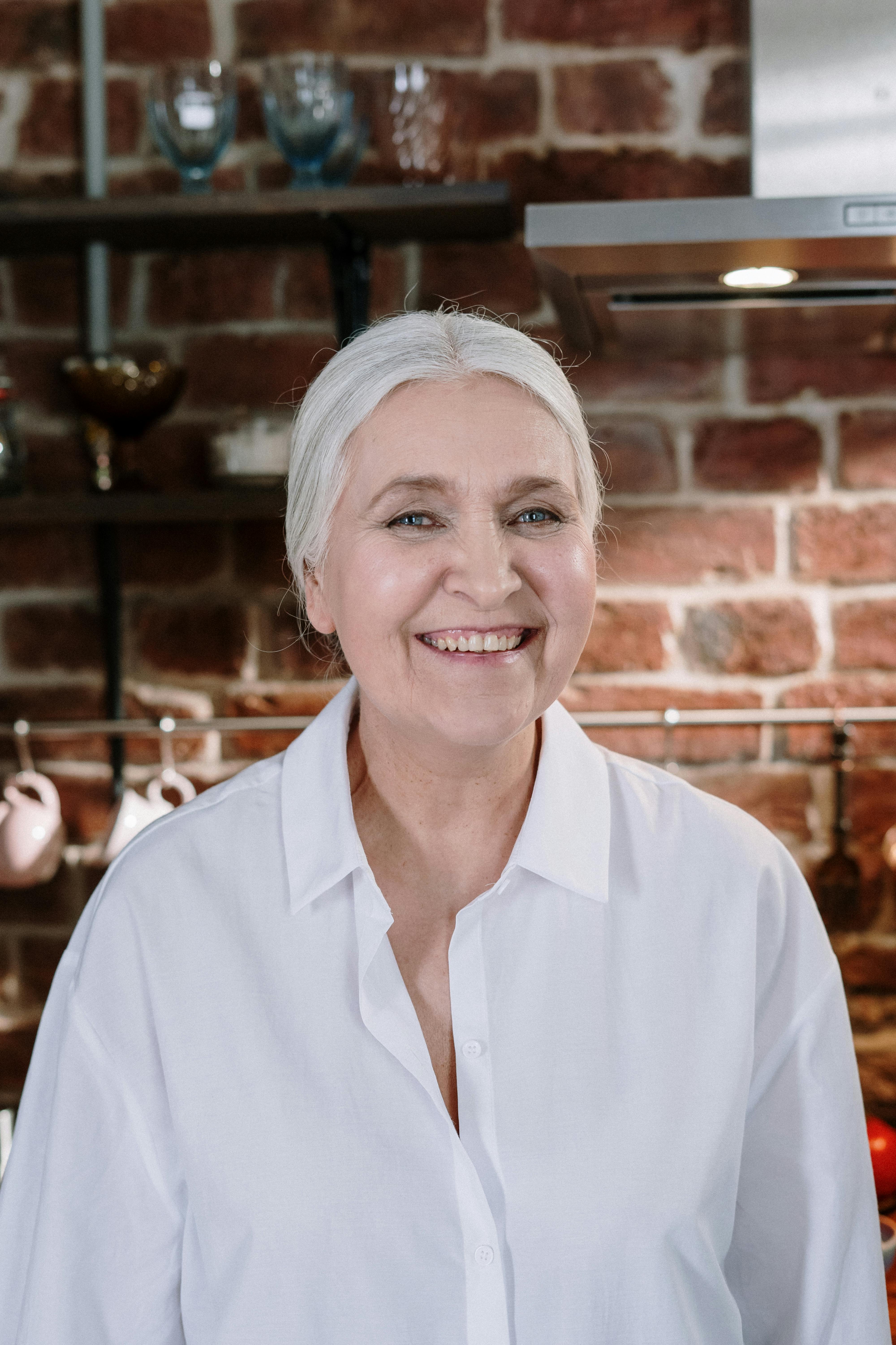 Cheerful woman behind the counter | Source: Pexels