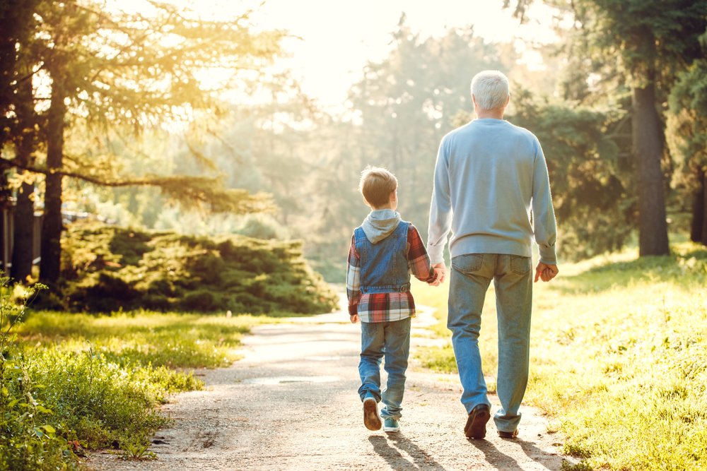 A photo of a boy taking a walk with his grandfather | Photo: Shutterstock