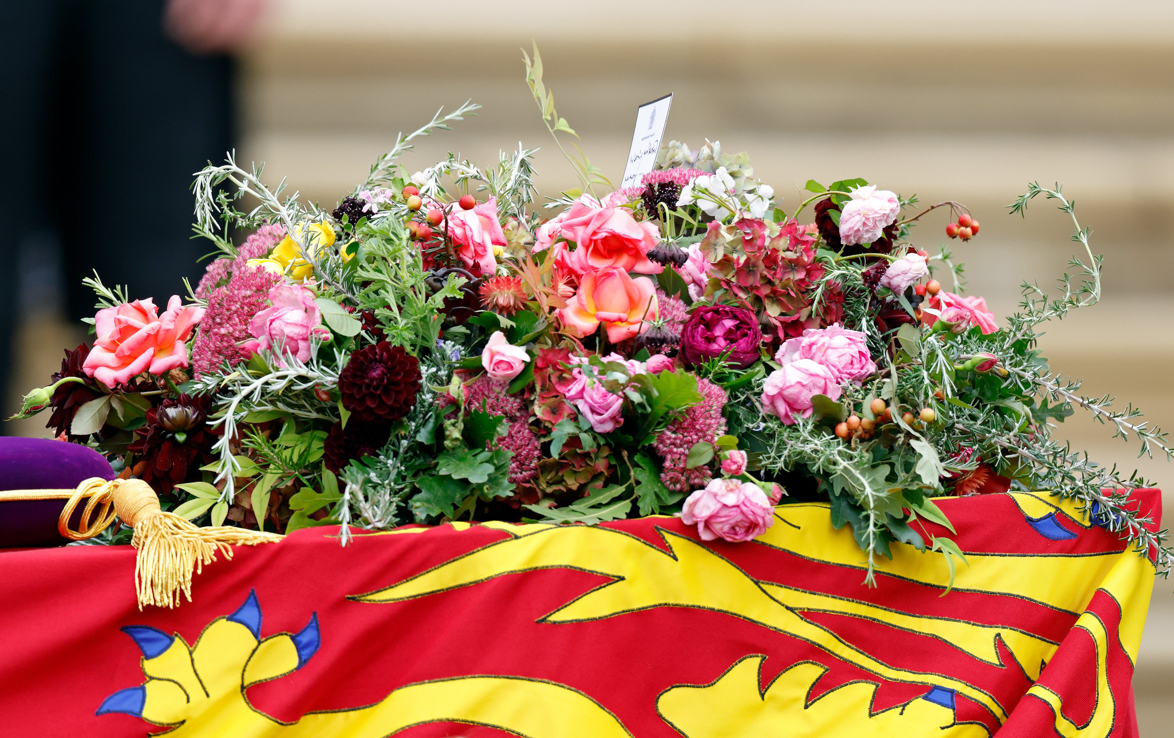 A funeral wreath comprising of Pelargoniums, Roses, Hydrangea, Sedum, Dahlias, Scabious, Rosemary, Myrtle and Oak cut from the gardens of Buckingham Palace, Clarence House and Highgrove House adorns Queen Elizabeth II's Royal Standard draped coffin at her Committal Service at St George's Chapel, Windsor Castle on September 19, 2022 in Windsor, England | Source: Getty Images 