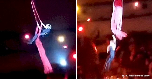 Circus acrobat plummets from a great height to the ground while performing difficult trick