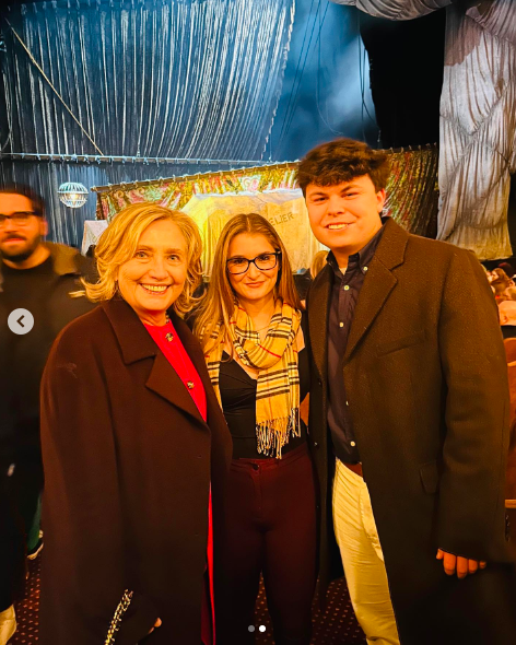 Hillary Clinton, Teresa and Blake ODonnell posing for a picture after Teresa and Blake got engaged, posted on December 19, 2022 | Source: Instagram/rosie