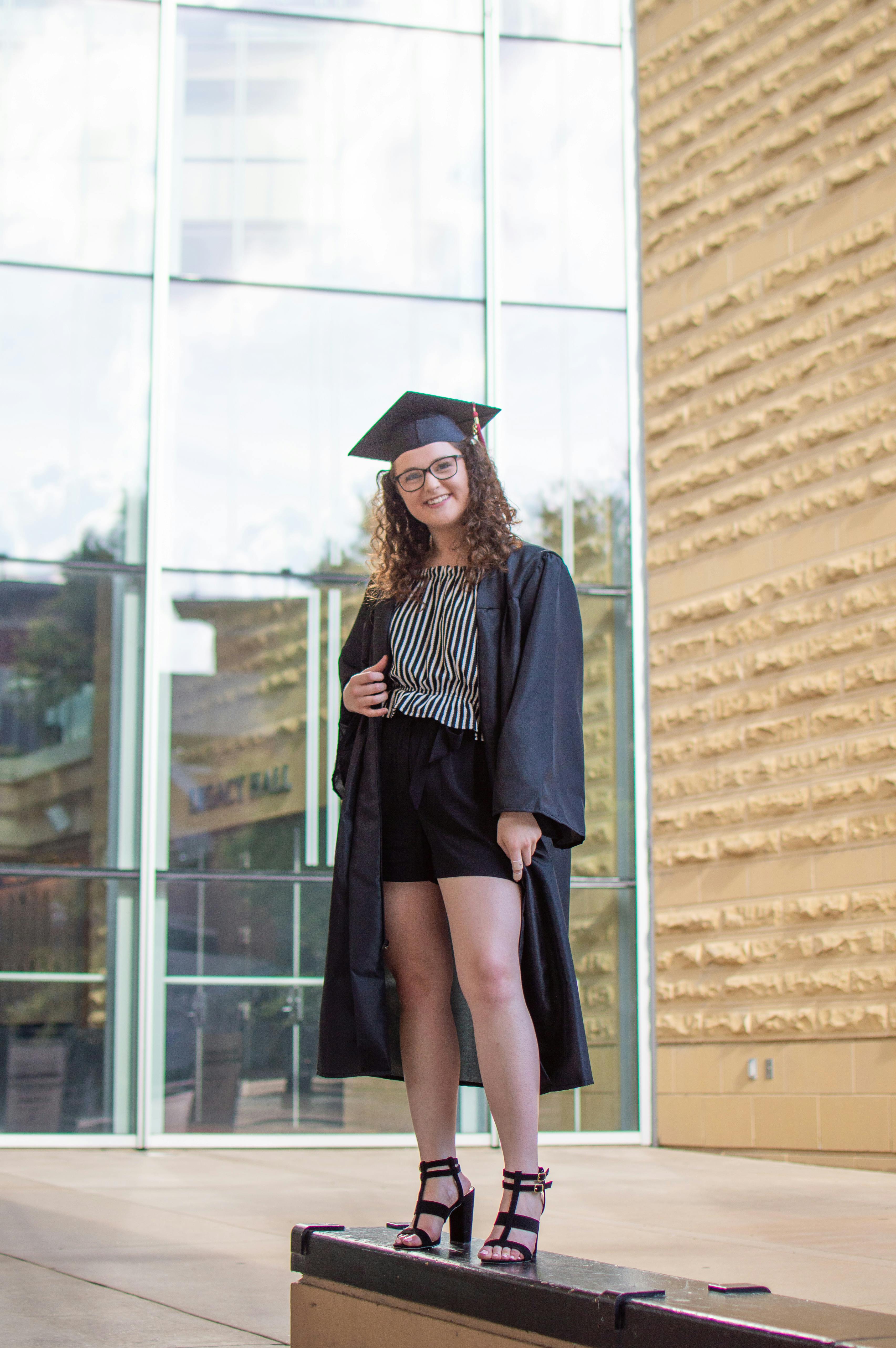 A proud college graduate posing for a picture | Source: Pexels