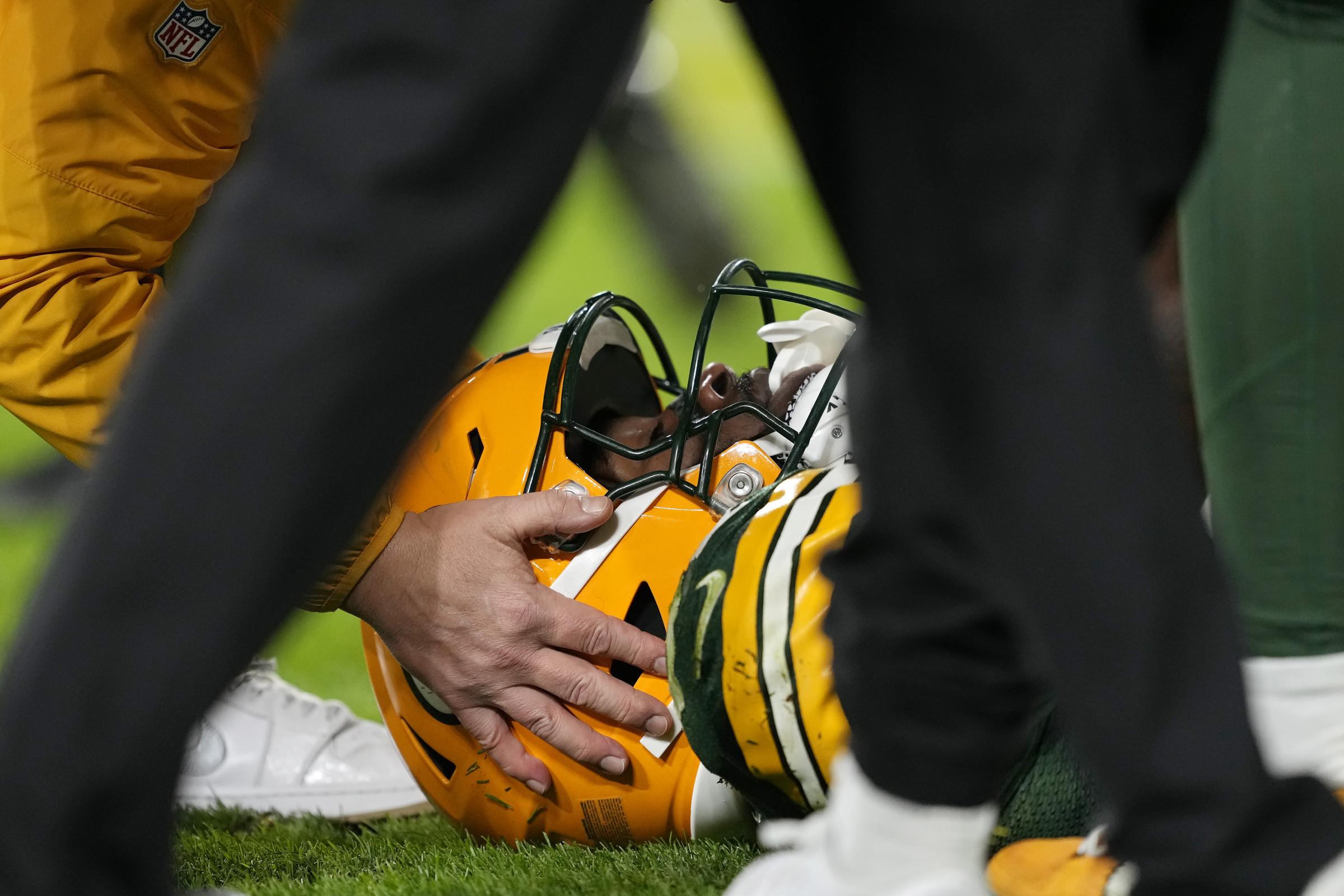 Romeo Doubs treated for an injury during the third quarter against the San Francisco 49ers at Lambeau Field on November 24, 2024 | Source: Getty Images