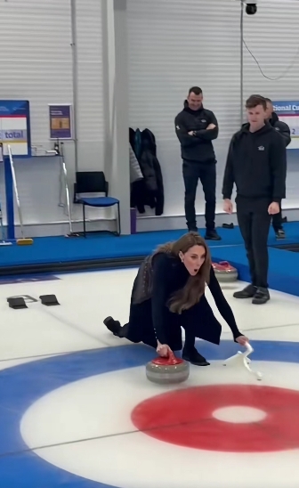 With eyes wide and mouth open in delighted surprise, Princess Kate reacted to the outcome of her curling attempt, offering a candid glimpse of her personality as she remained poised low to the ice. The surrounding rink and attentive instructors framed the scene, highlighting the informal, hands-on nature of the engagement. | Source: TikTok/hellomag
