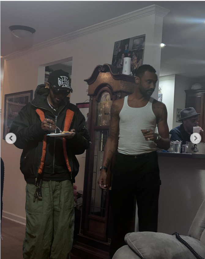 An indoor, casual home setting, Niko and Brian McKnight stand near a dining or living area, from a post dated September 28, 2025. | Source: Instagram/itsjuliemcknight