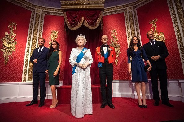 Madame Tussauds' wax of The Queen, the Duke of Edinburgh ,The Duke and Duchess of Sussex and The  Duke and Duchess of Cambridge | Photo:Getty Images
