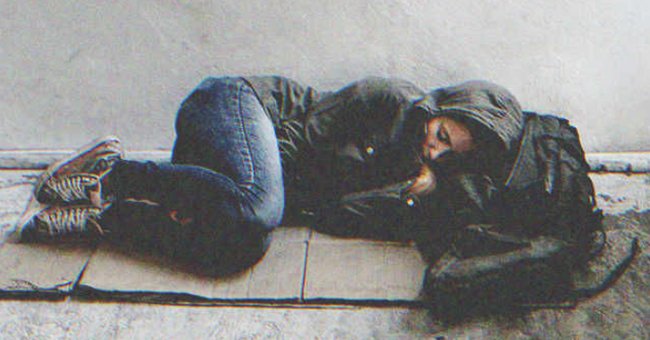 A young homeless girl sleeping in the floor | Source: Shutterstock