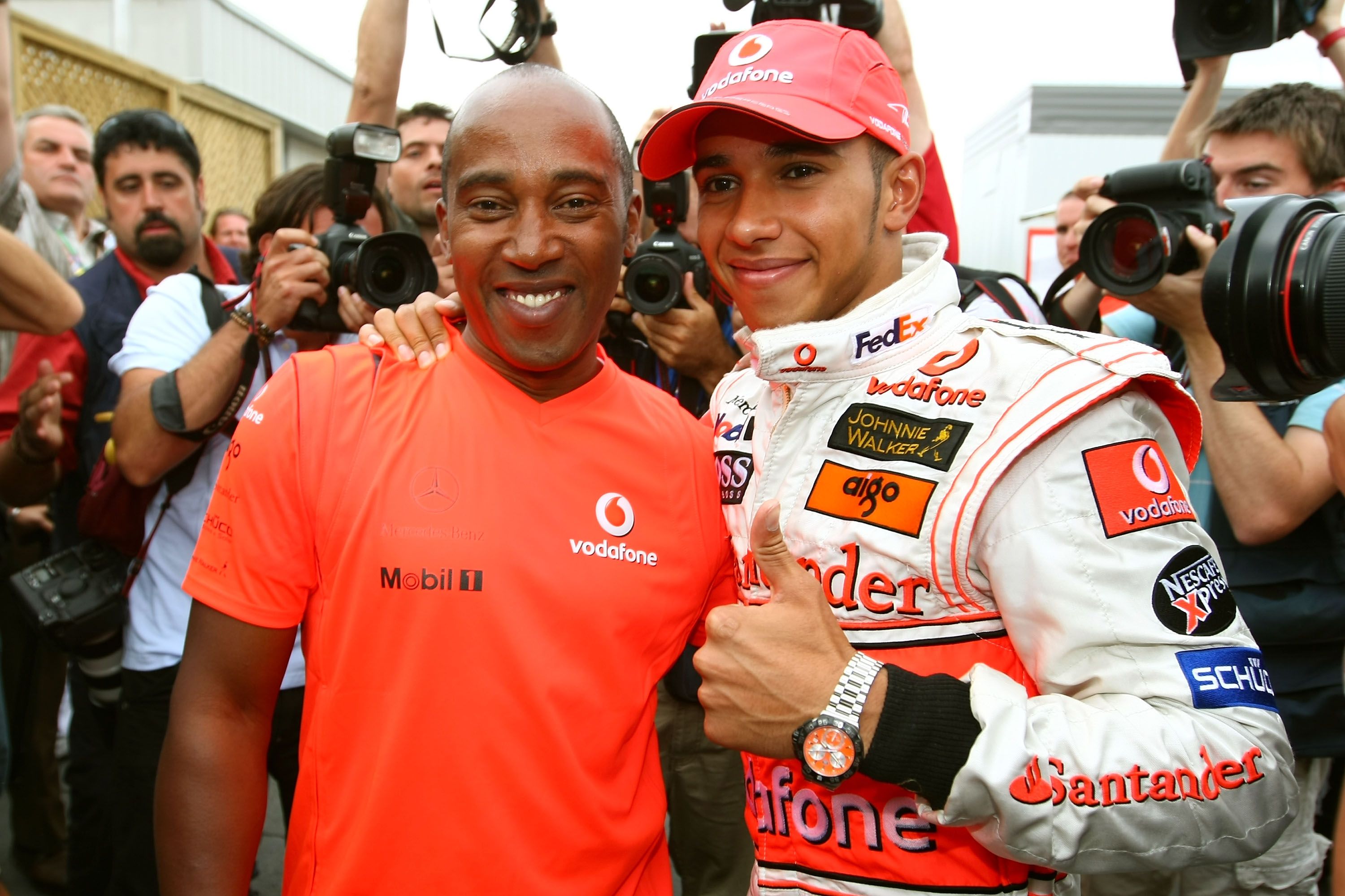 Lewis Hamilton of Great Britain and McLaren Mercedes celebrates with his father Anthony Hamilton in the paddock after winning his first Grand Prix in the Canadian Formula One Grand Prix at the Circuit Gilles Villeneuve on June 10, 2007 | Photo: Getty Images