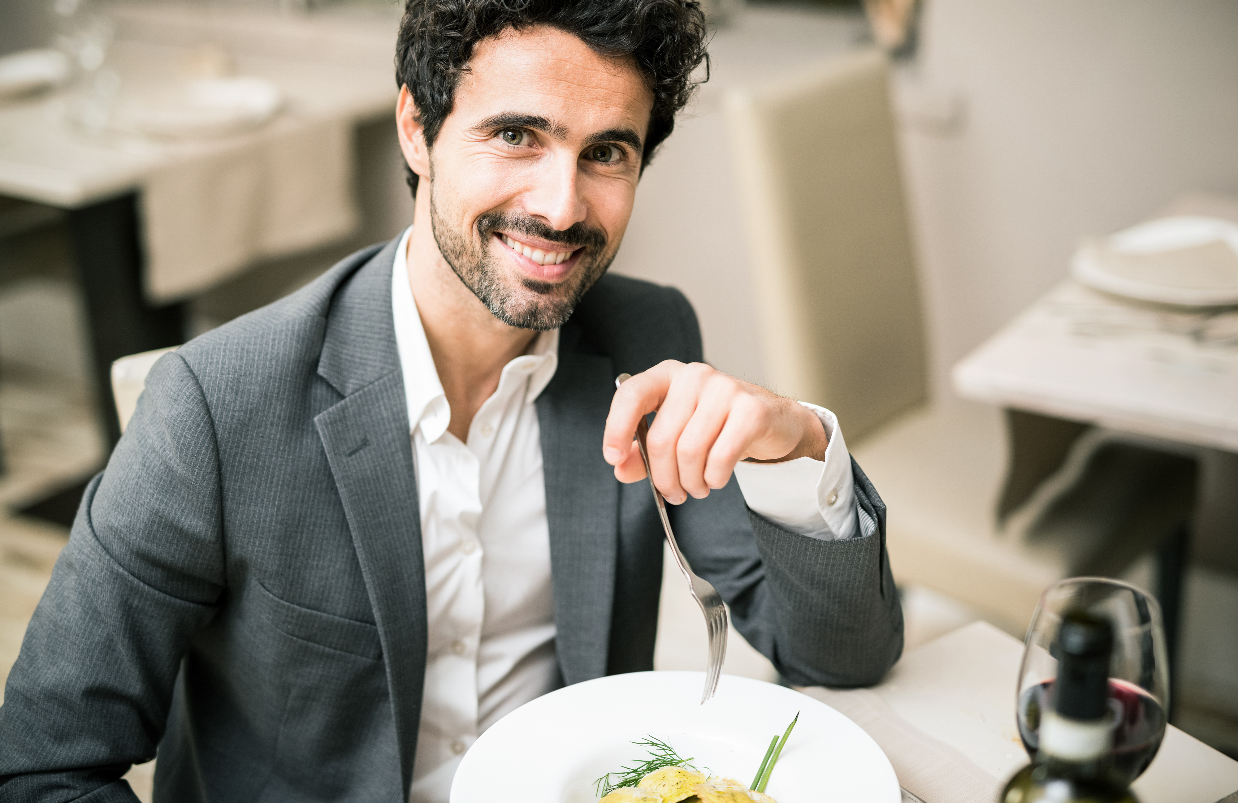 Man having lunch in a restaurant | Source: Shutterstock