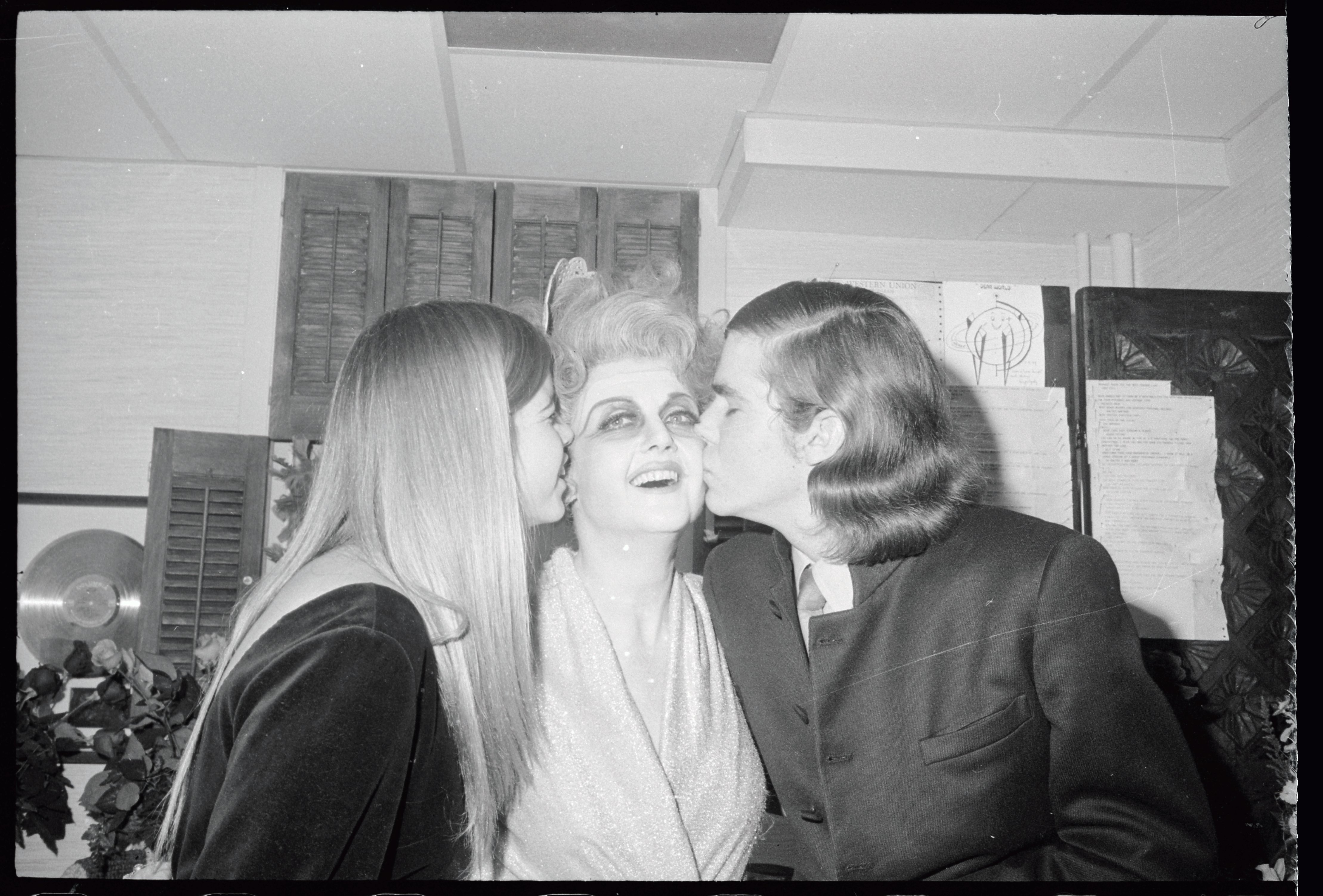 Angela Lansbury is kissed by her children, Deidre, 16, and Anthony, 17, following her opening night performance in the musical "Dear World" at the Mark Hellinger in January on January 16, 1969. | Source: Getty Images
