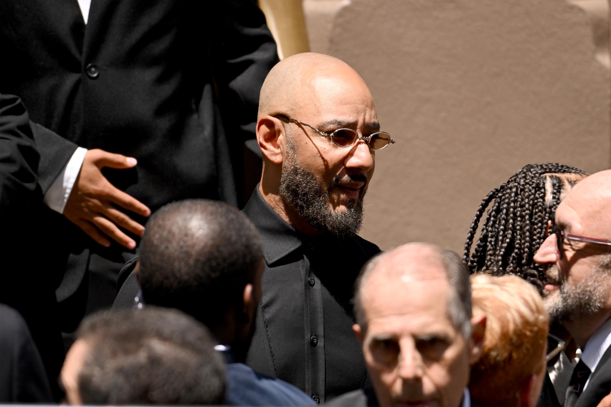 Swizz Beats was another artist in attendance, but unlike Usher, he looked serious outside of the synagogue. | Source: Getty Images