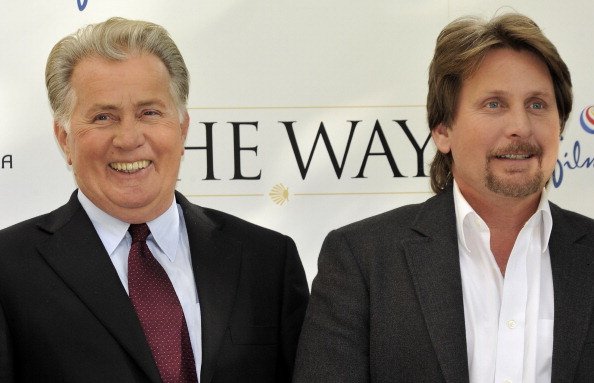Actor Martin Sheen (L) and director Emilio Estevez (R) attend "The Way" photocall at the Ritz Hotel on November 10, 2010, in Madrid, Spain. | Source: Getty Images.