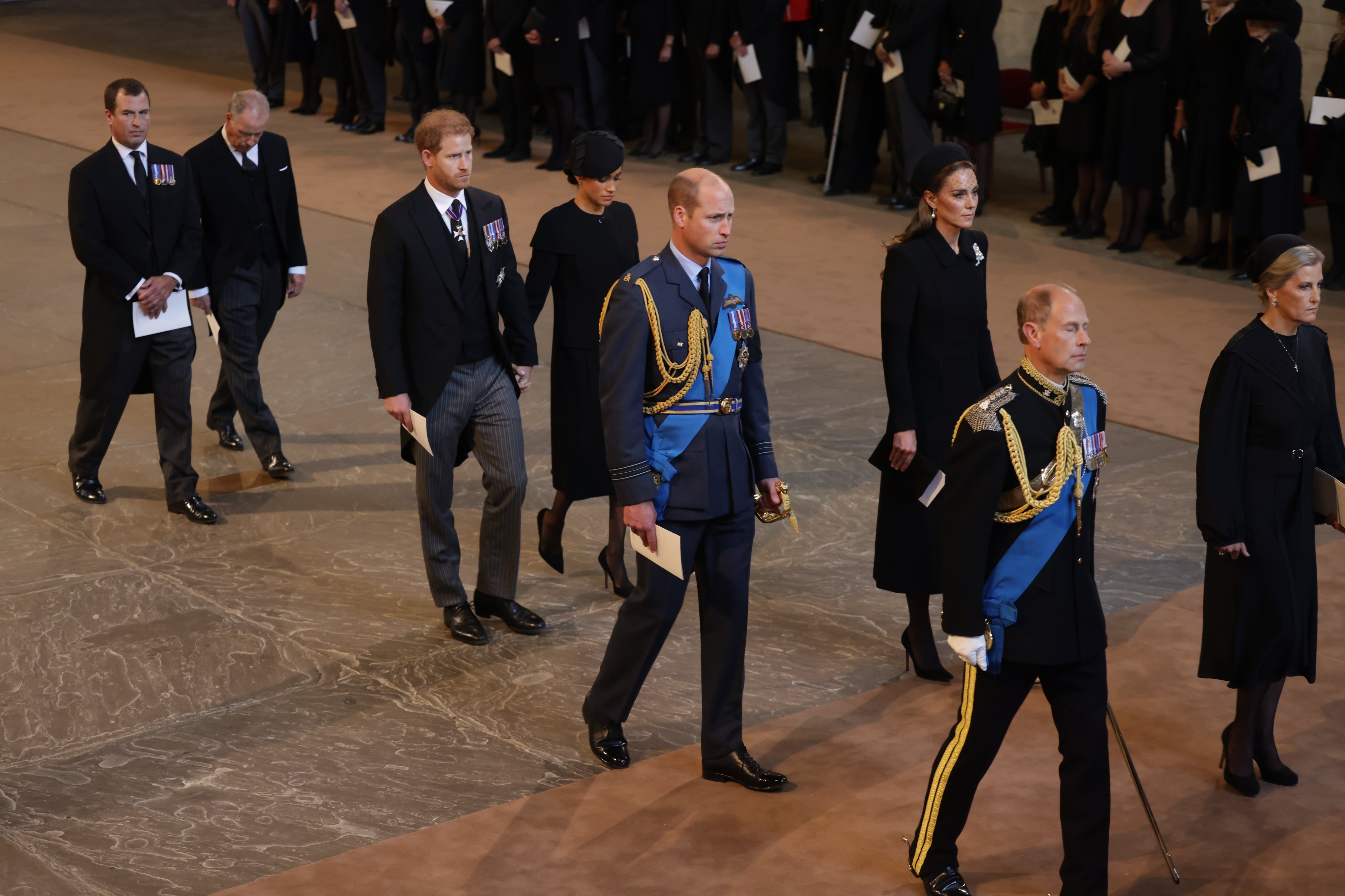 Peter Phillips, David Armstrong-Jones, Earl of Snowdon, Prince Harry, Duke of Sussex, Meghan, Duchess of Sussex, Prince William, Prince of Wales, Catherine, Princess of Wales, Edward, Earl of Wessex and Sophie, Countess of Wessex leave Westminster Hall on September 14, 2022 in London, United Kingdom | Source: Getty Images 