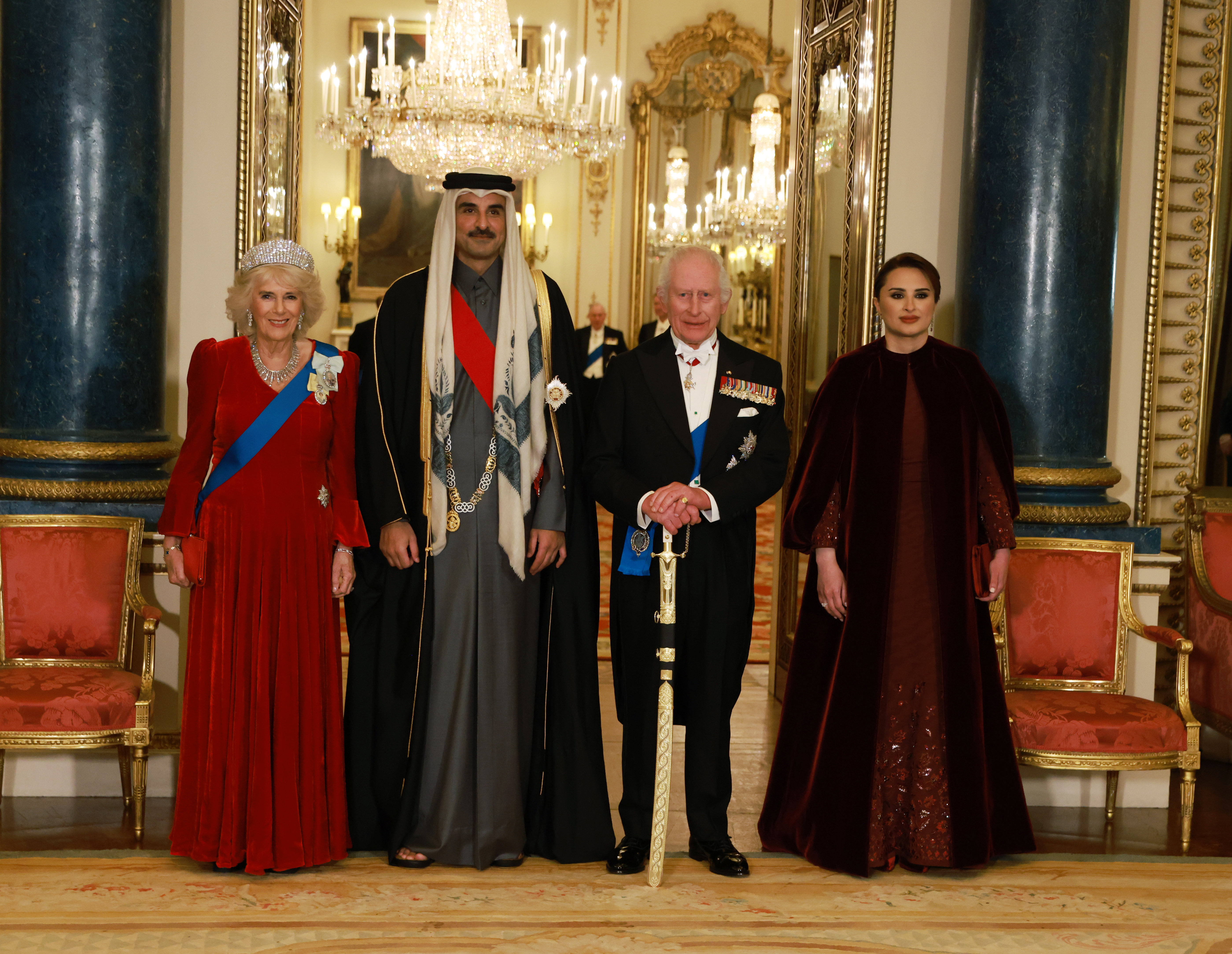 Queen Camilla, Sheikh Tamim bin Hamad Al Thani, King Charles III, and Sheikha Jawaher bint Hamad bin Suhaim Al Thani attend the state banquet at Buckingham Palace in London on December 3, 2024 | Source: Getty Images