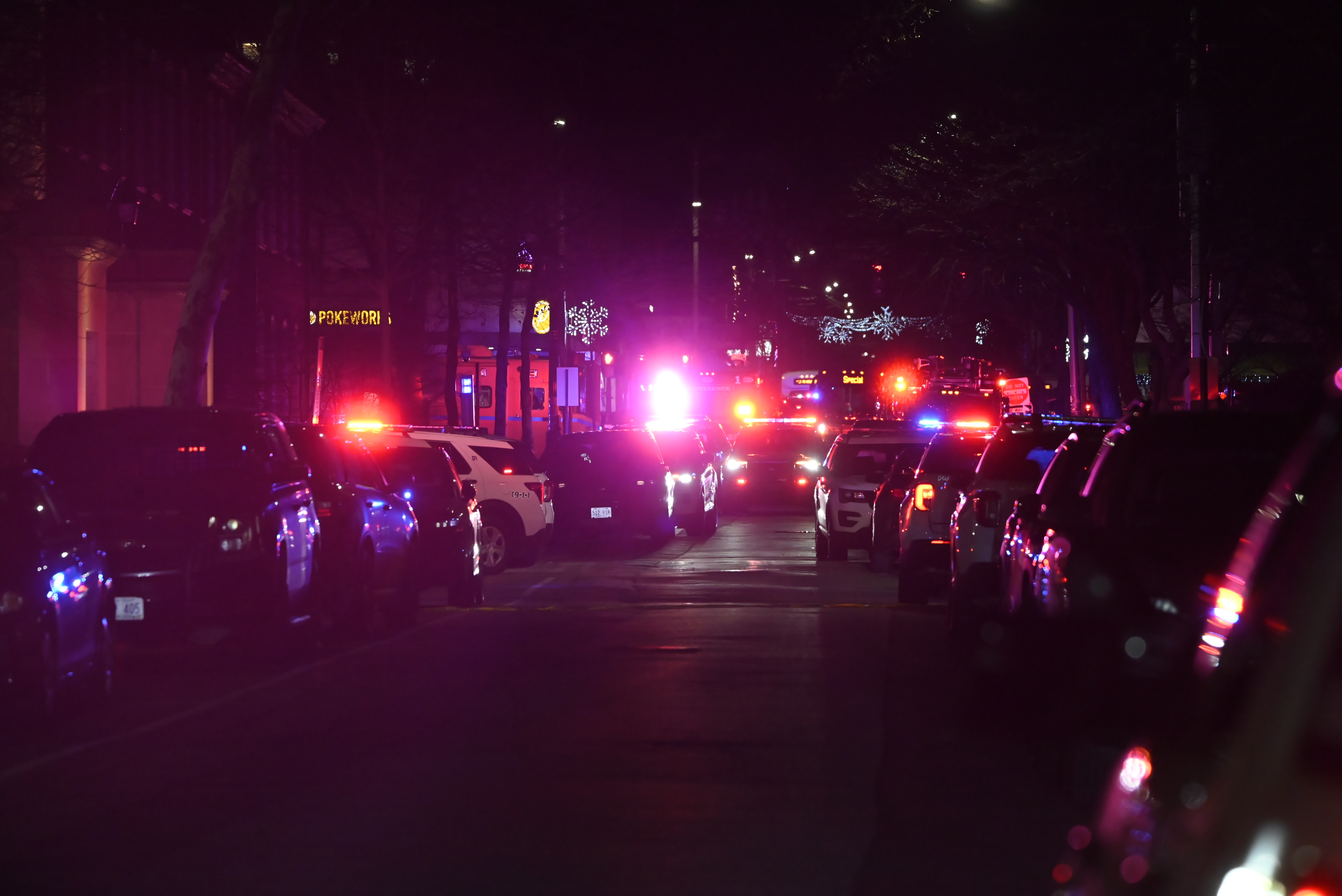 Emergency personnel work the scene, block off several buildings and establish a crime scene security cordon at Brown University on December 13, 2025, in Providence, Rhode Island, after a mass shooting | Source: Getty Images