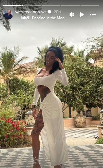 Katie Price is pictured in a cut-out white dress while posing for solo photos during the symbolic wedding celebrations in Dubai. | Source: Instagram/wesleeeandrews