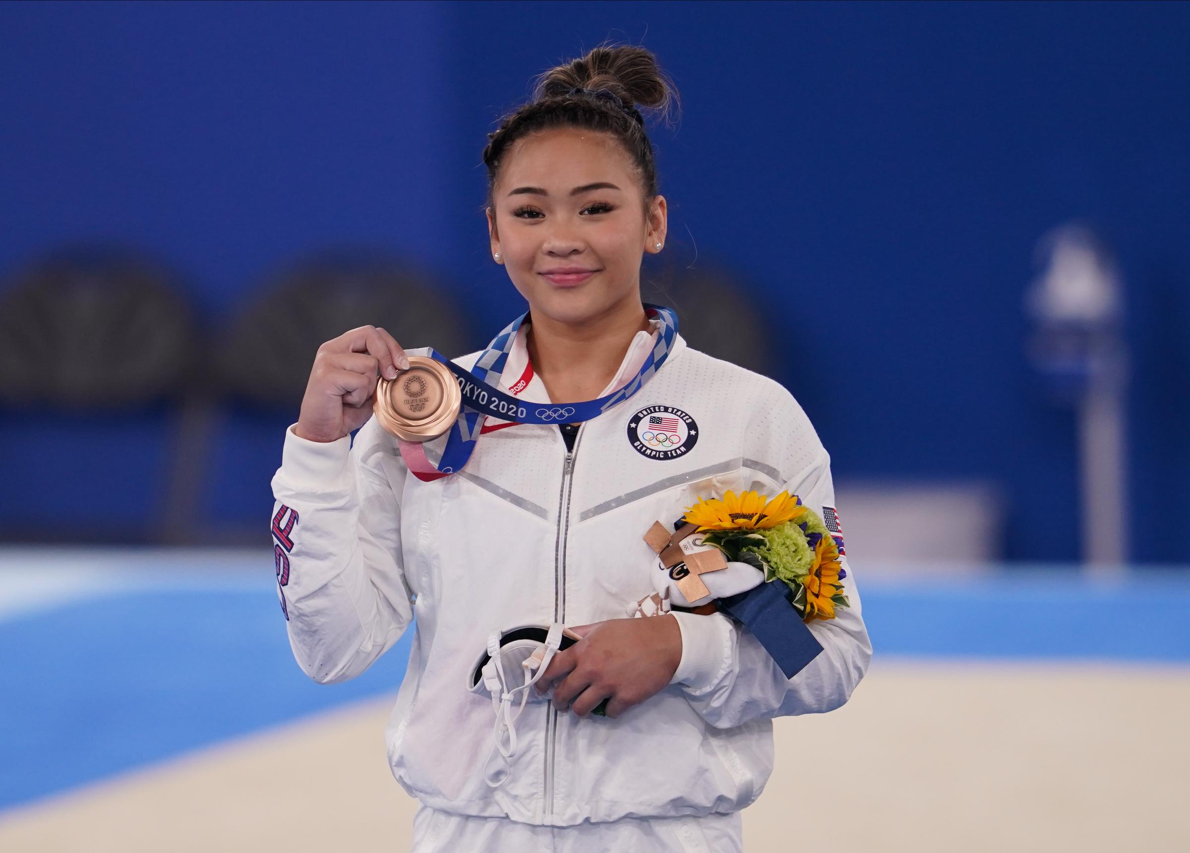 Bronze medalist US's Sunisa Lee poses on the podium of the artistic gymnastics women's uneven bars final at the Tokyo Olympic Games in Japan on August 1, 2021 | Source: Getty Images